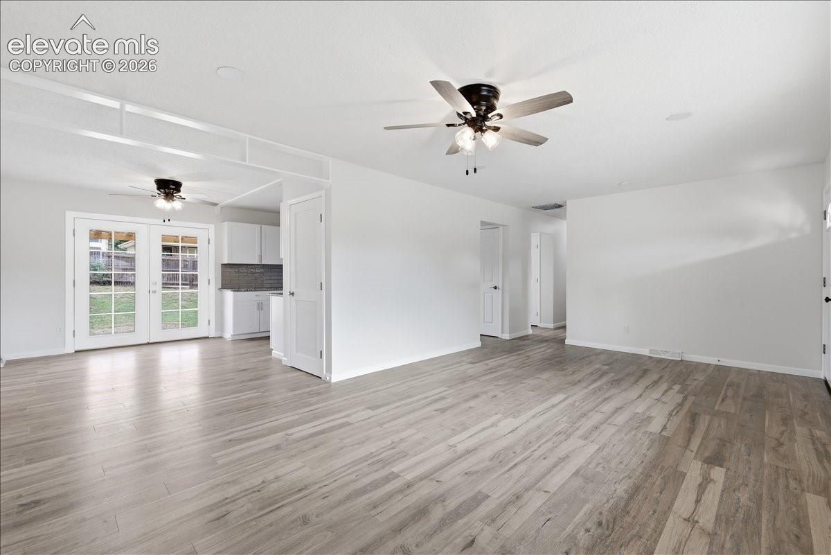 Very open with French doors to the backyard.