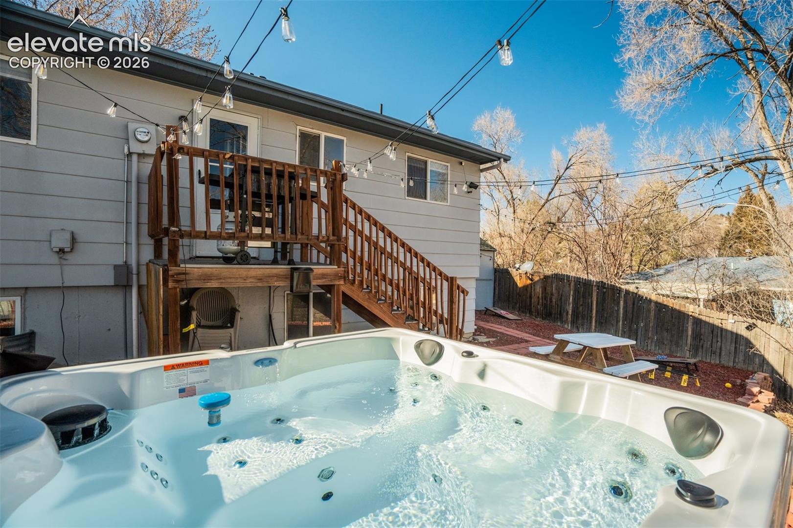 White outdoor hot tub with multiple jets