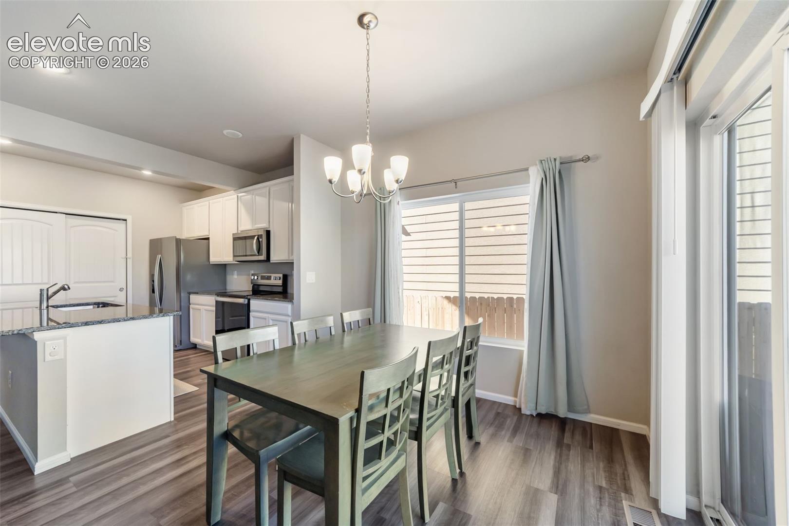Dining area with easy access to the kitchen and backyard.