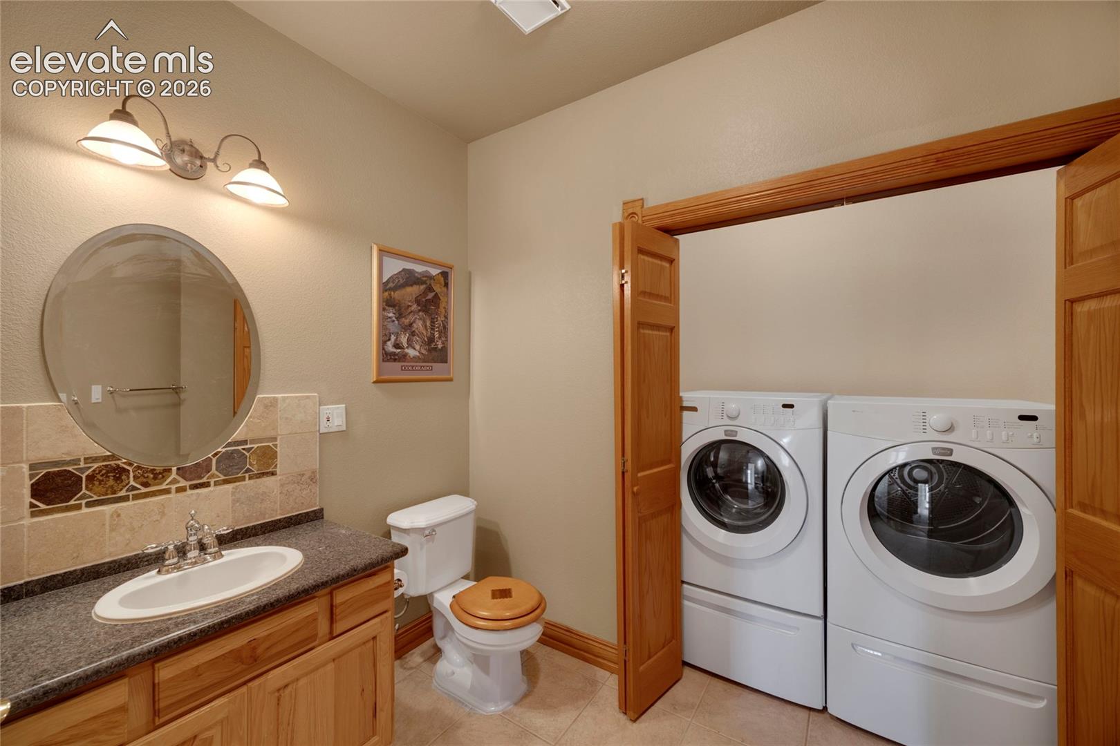 Basement 1/2 bath with second laundry hookup  