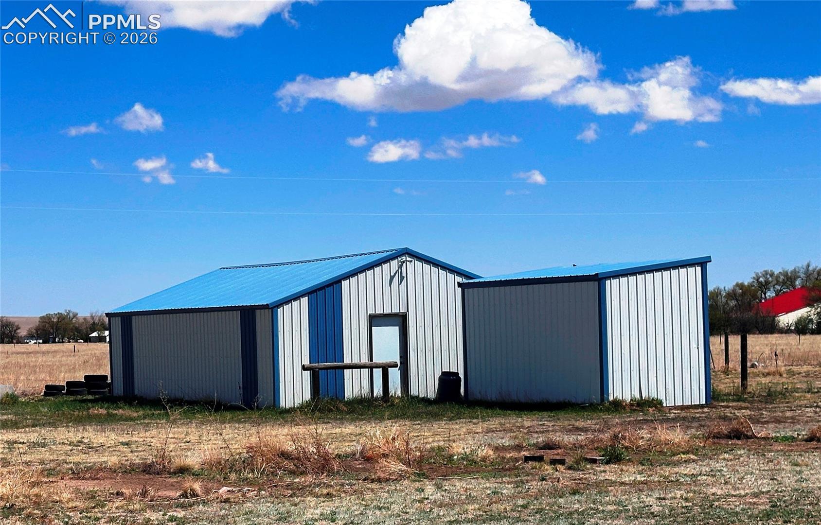 There are over 2,800 square feet in 5 outbuildings on the property. Original owner kept 2 horses, which could be kept there on this nearly 5-acre fenced property.