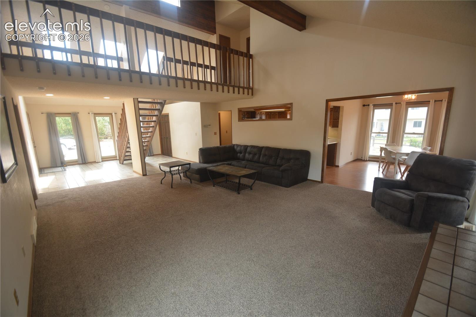 view from living room toward entry and dining room