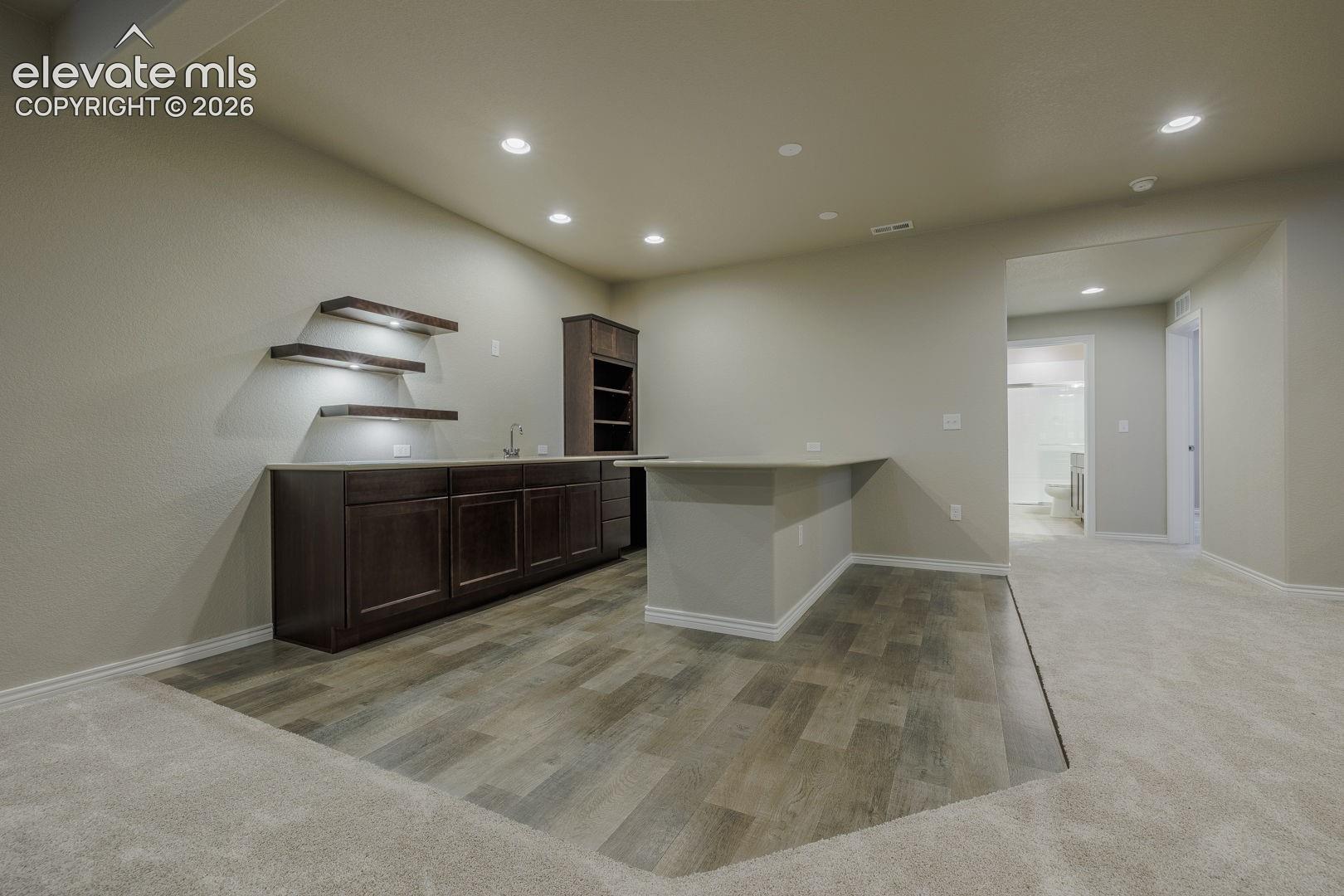 wet bar with LVP flooring