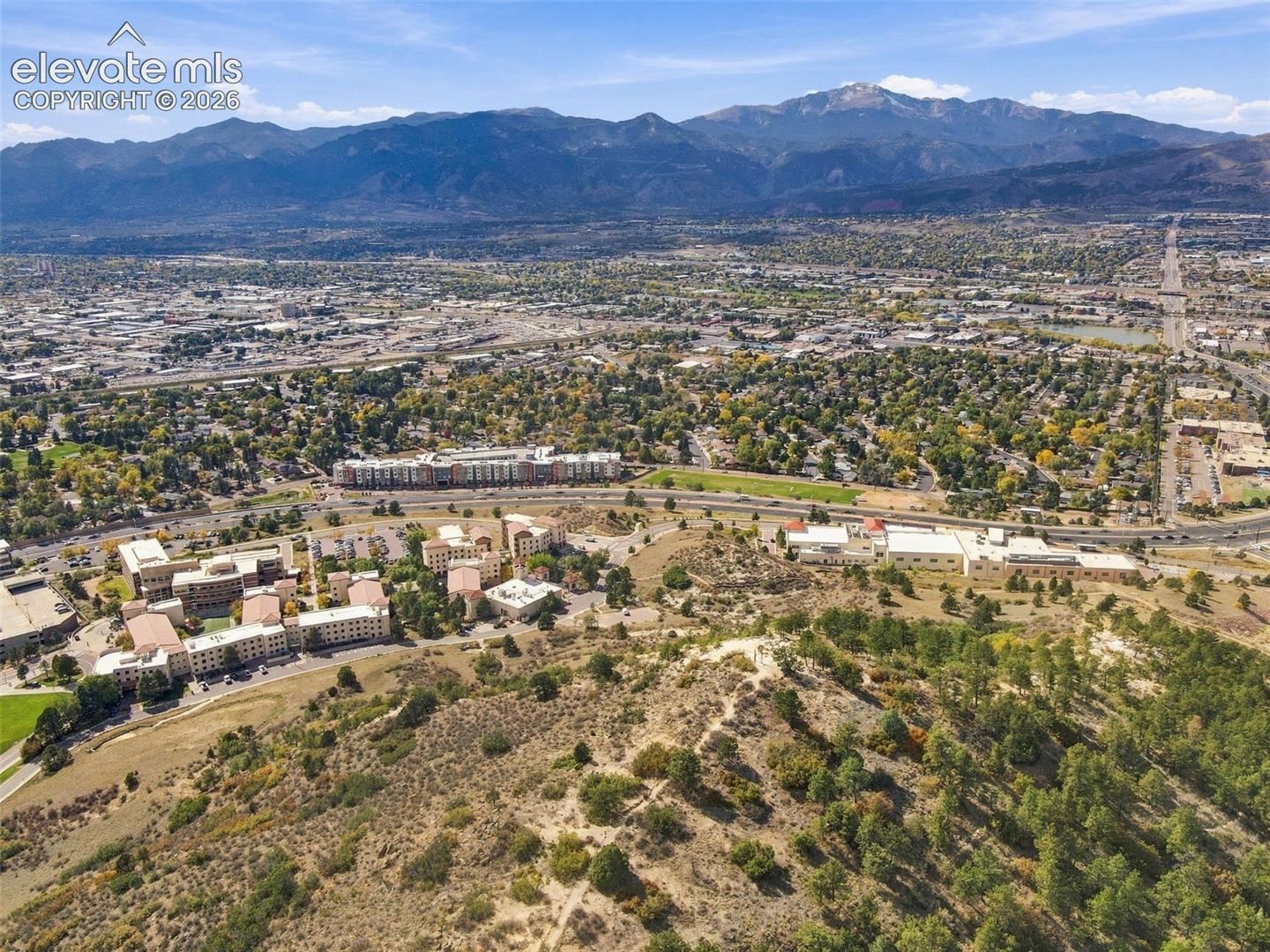 Aerial perspective showcasing extensive mountain range topography and expansive natural terrain
