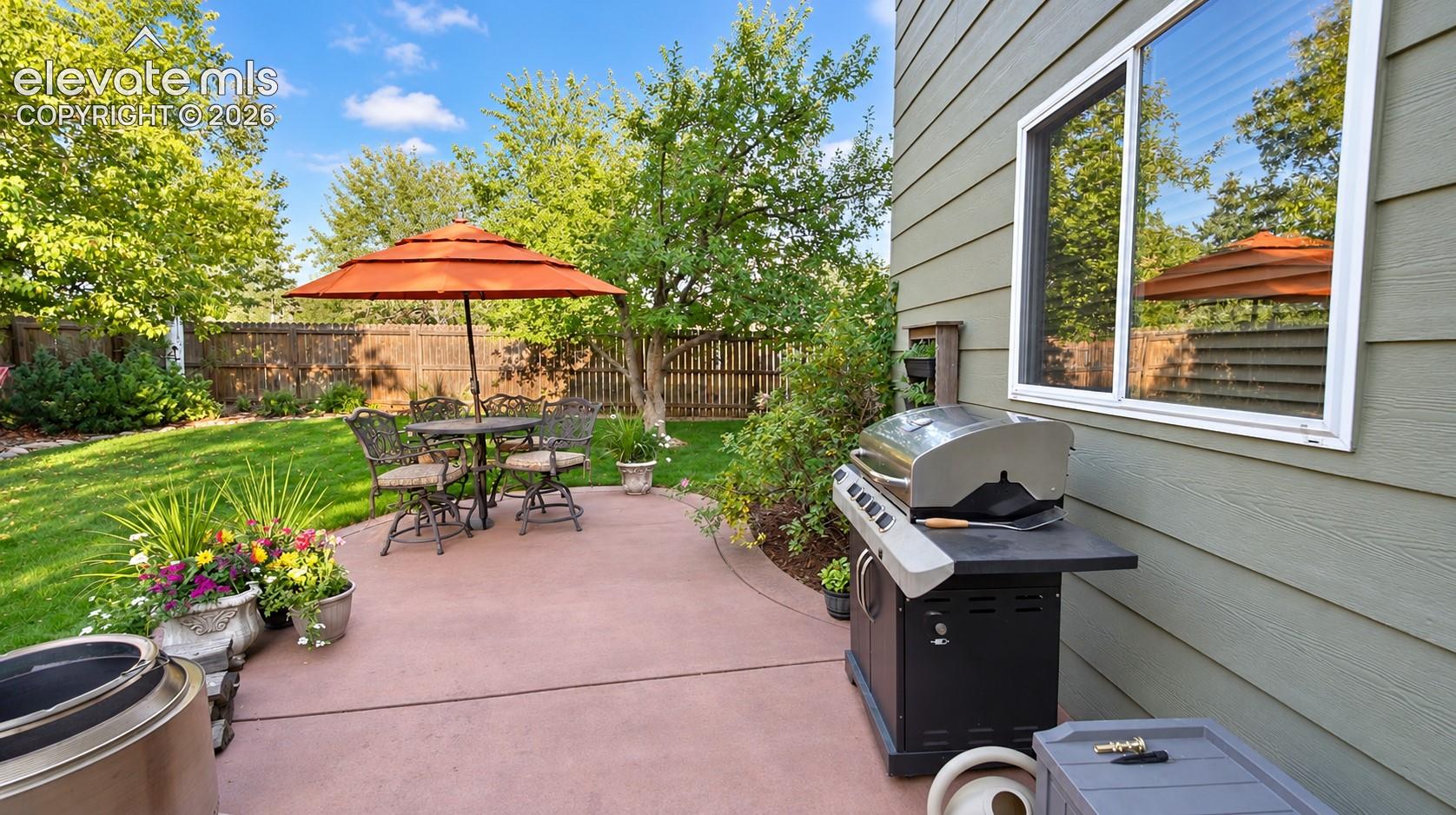 The backyard patio is the perfect place for weekend BBQs.