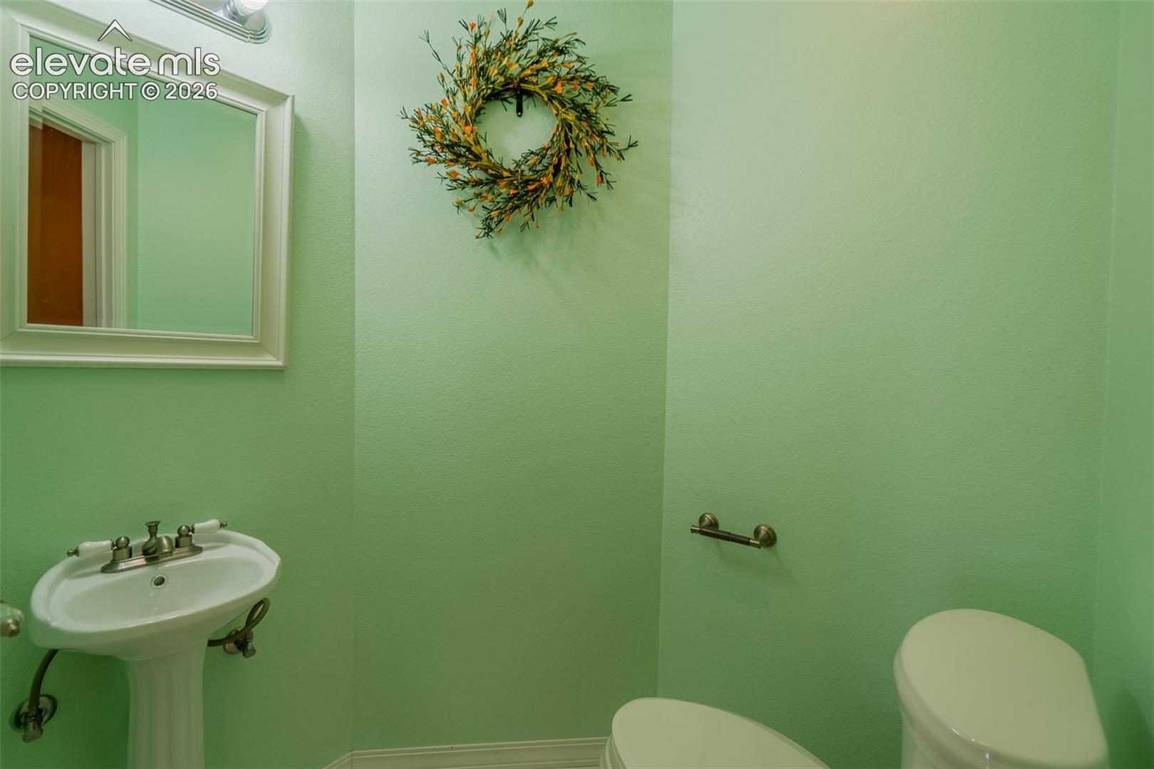 Stylish powder room offers added convenience for family and visitors.