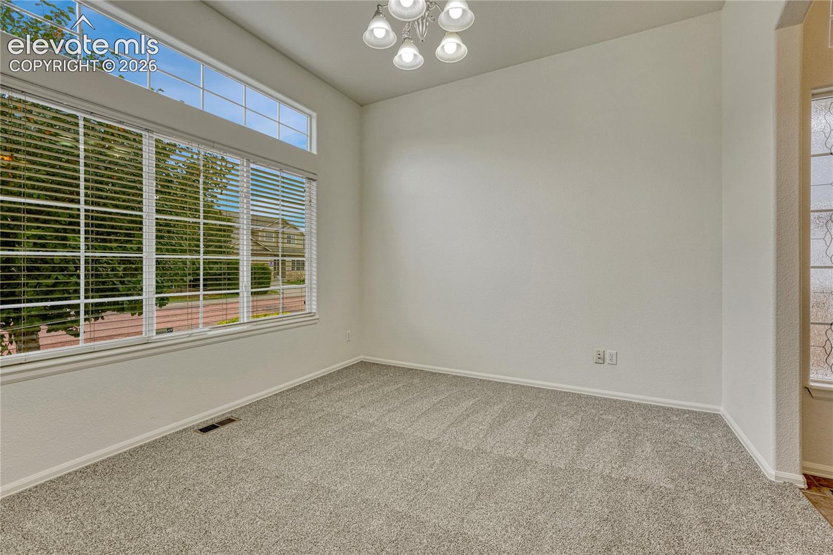 Main level office with new carpet and paint...