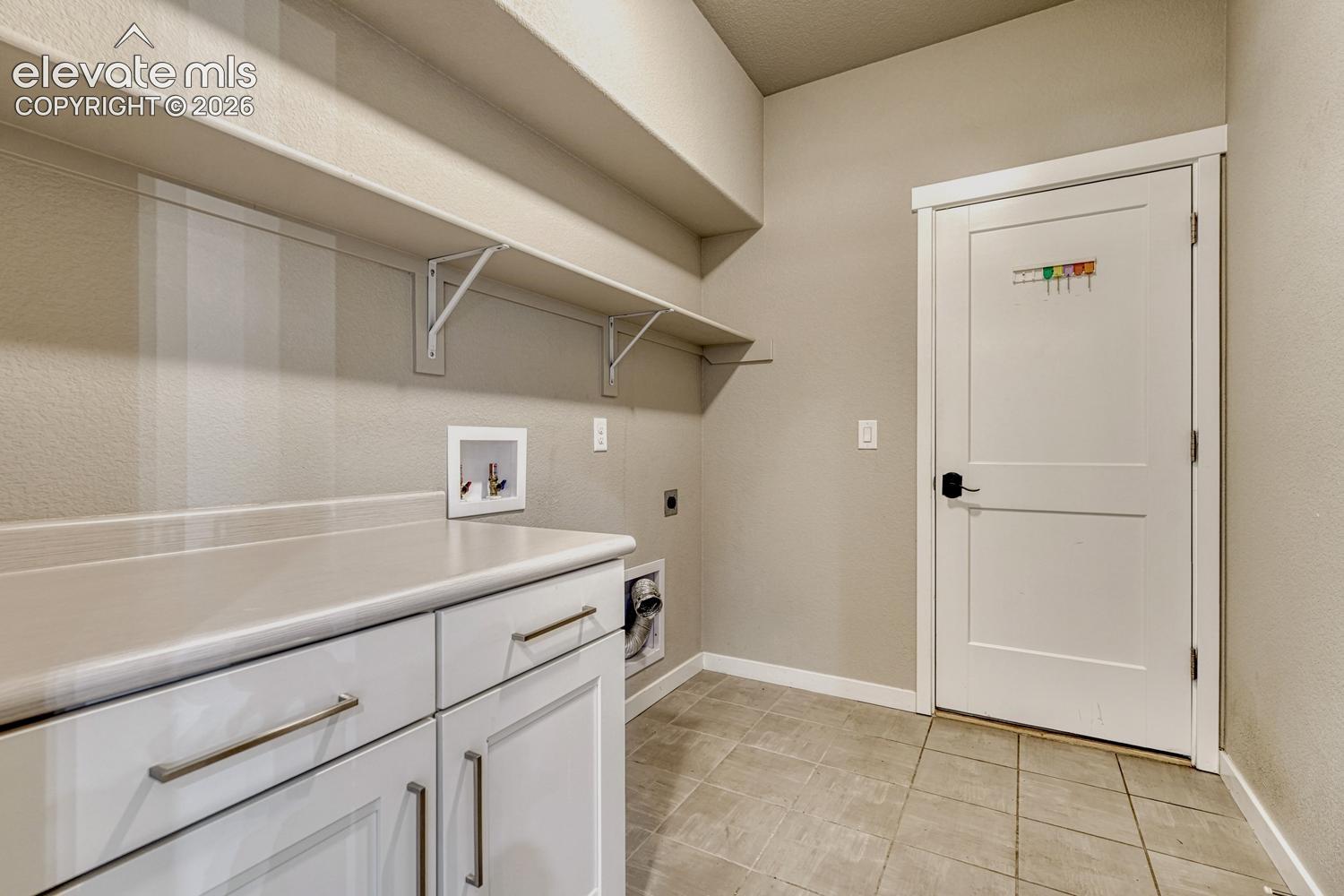 laundry on main leading to garage