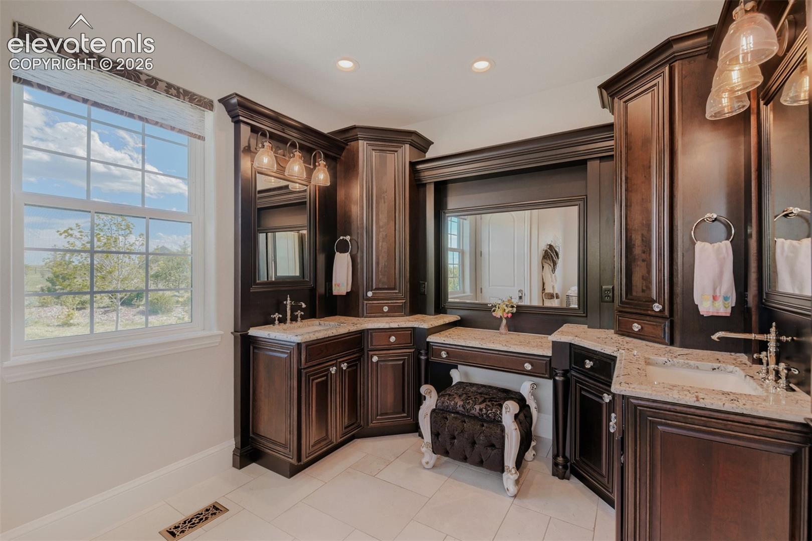 Beautiful, custom cabinetry, make up seating
