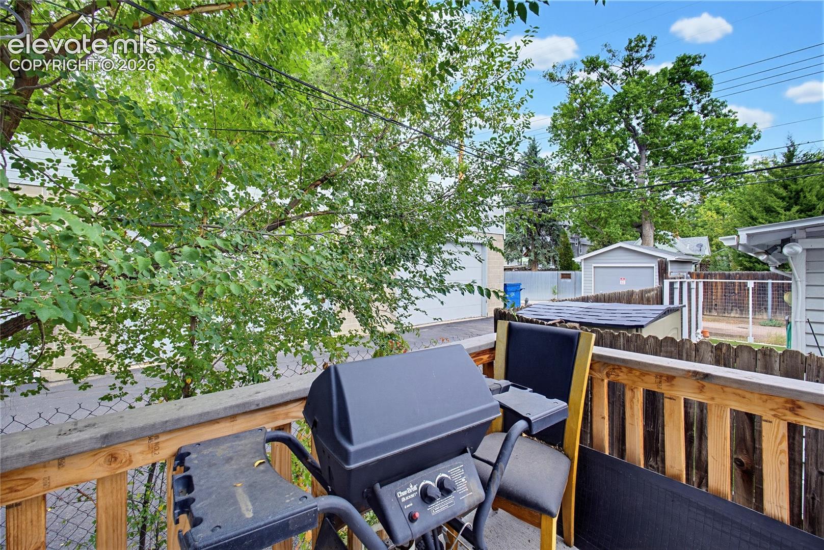 Outdoor wooden deck with slatted railing