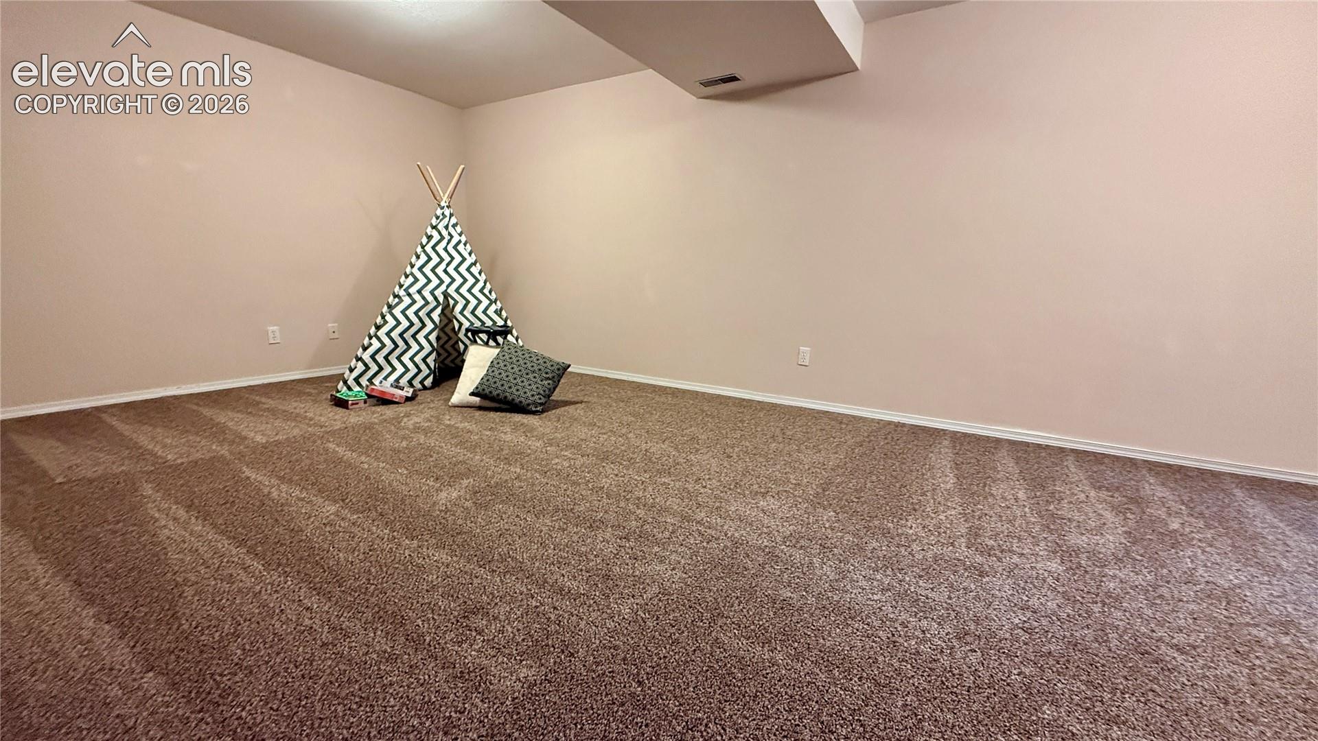Large room in the basement...can be rec room, family room kids play area...etc...
