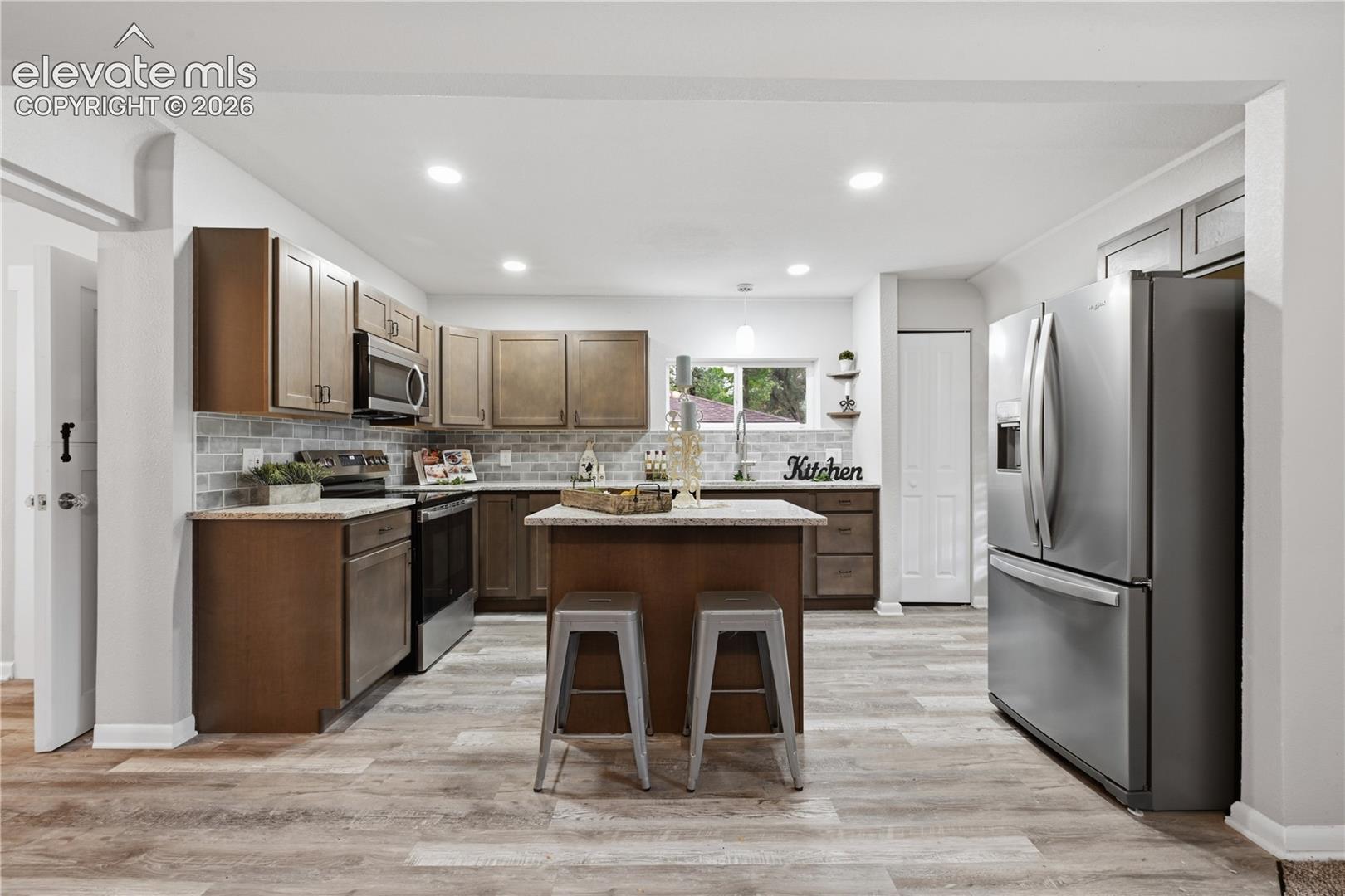 Another view of the kitchen. A pantry is included as well.