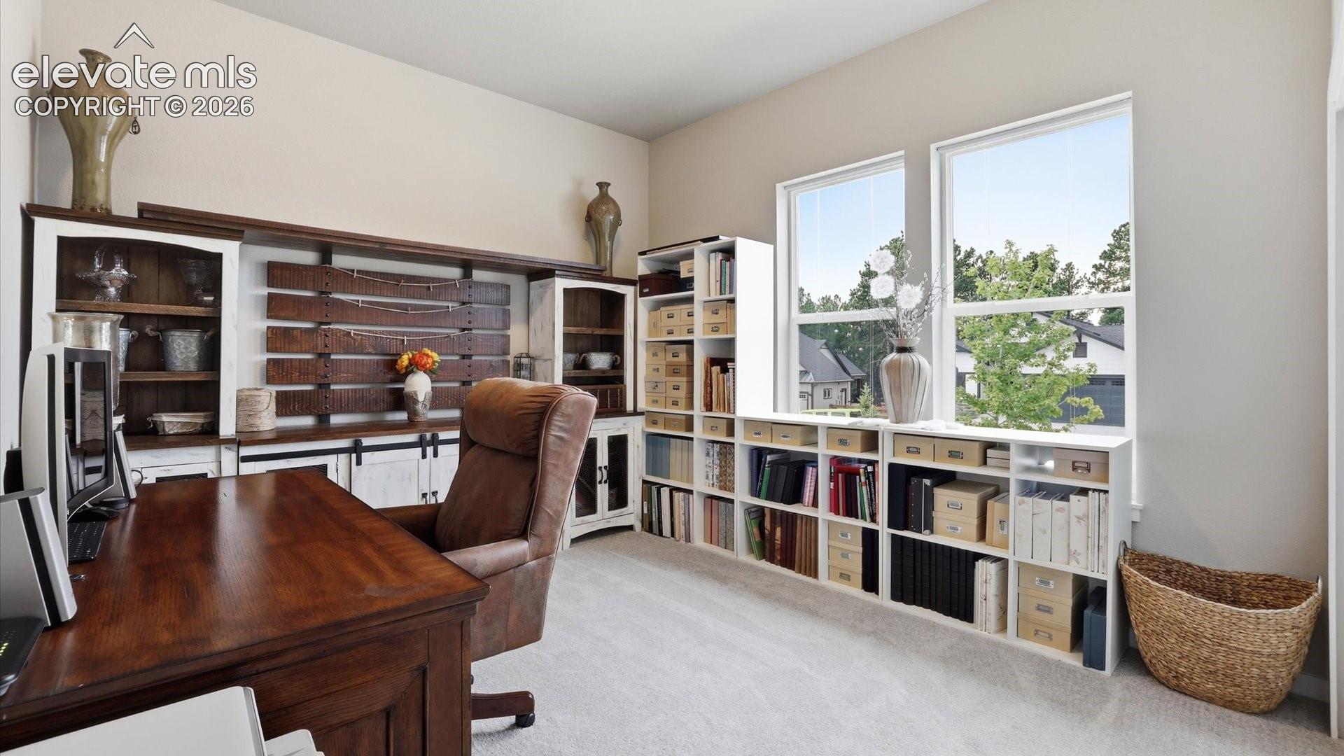 GENEROUS MAIN-LEVEL LIVING — A spacious second main-level bedroom offers exceptional comfort, privacy, and flexibility for family or guests.