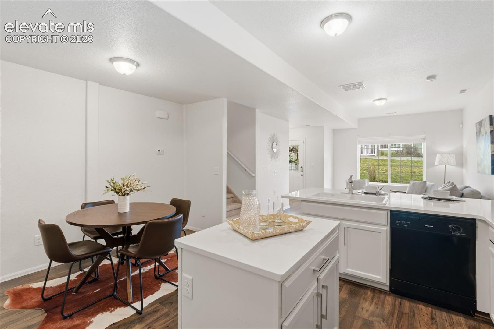 Host dinner parties in this spacious eat-in kitchen that comfortably fits a dining table alongside the island