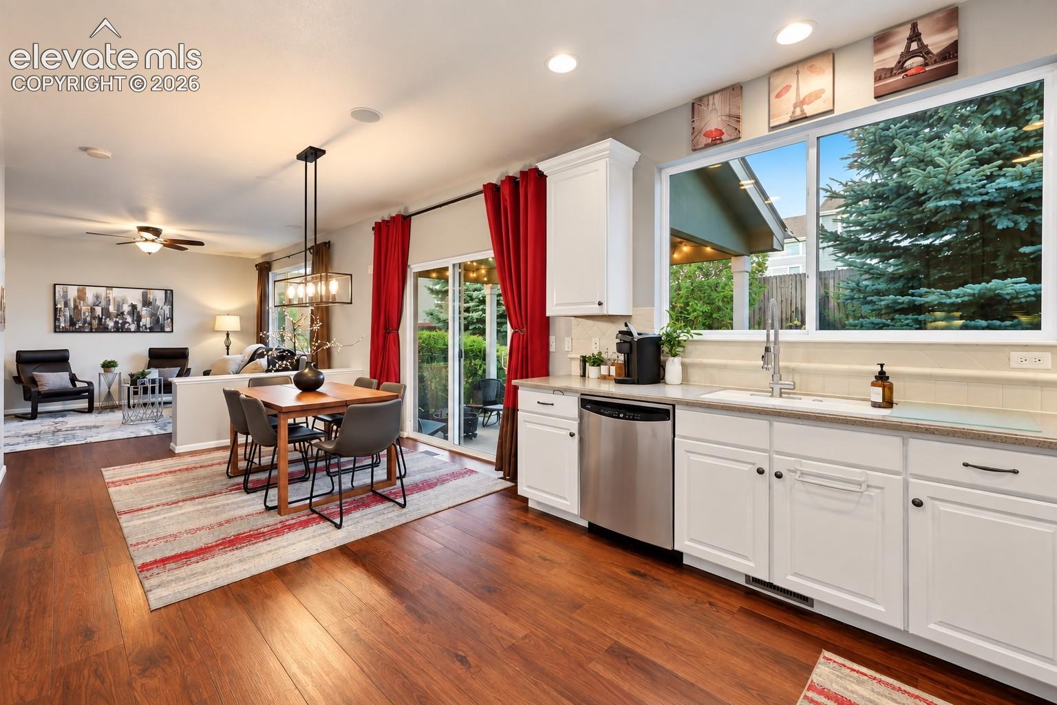 The kitchen's efficient layout offers excellent storage and an easy connection to the surrounding living spaces.