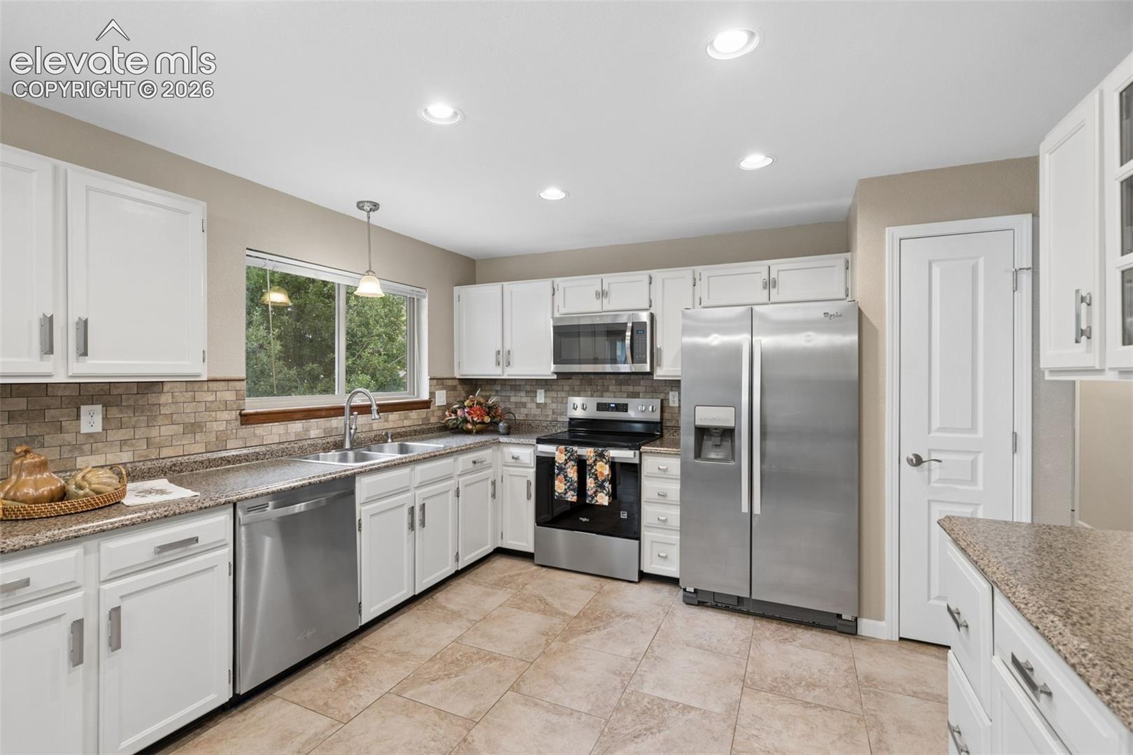 SS appliances, pantry closet, warm neutral tones