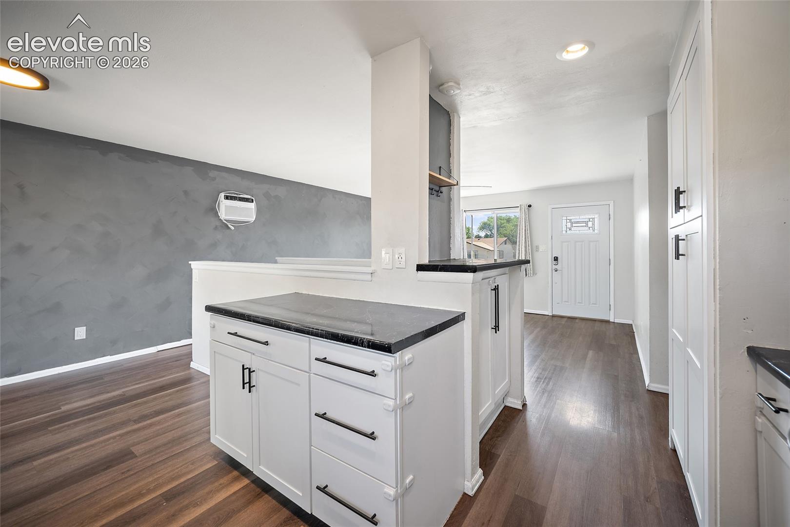 Kitchen overlooking dining room.