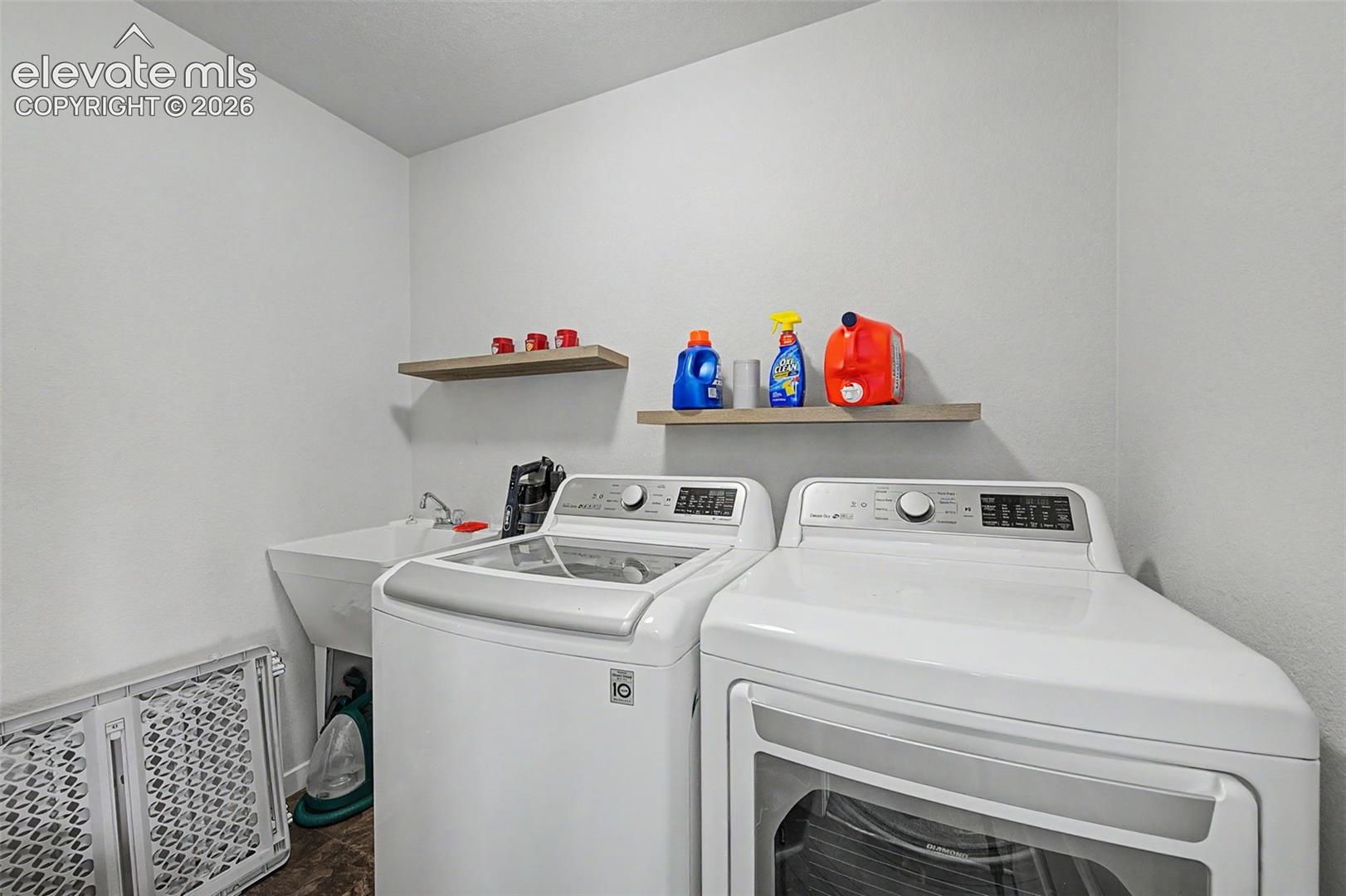 The convenient upper level laundry room includes a utility sink. Washer/dryer are excluded.