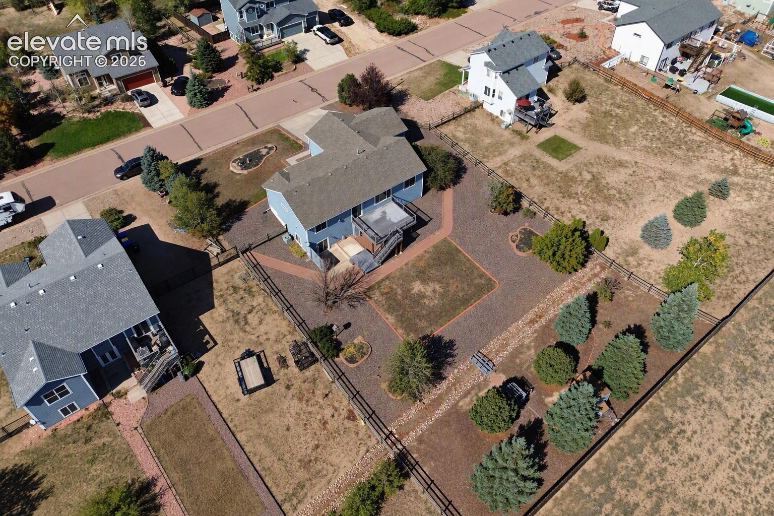 Aerial view of home and lot.