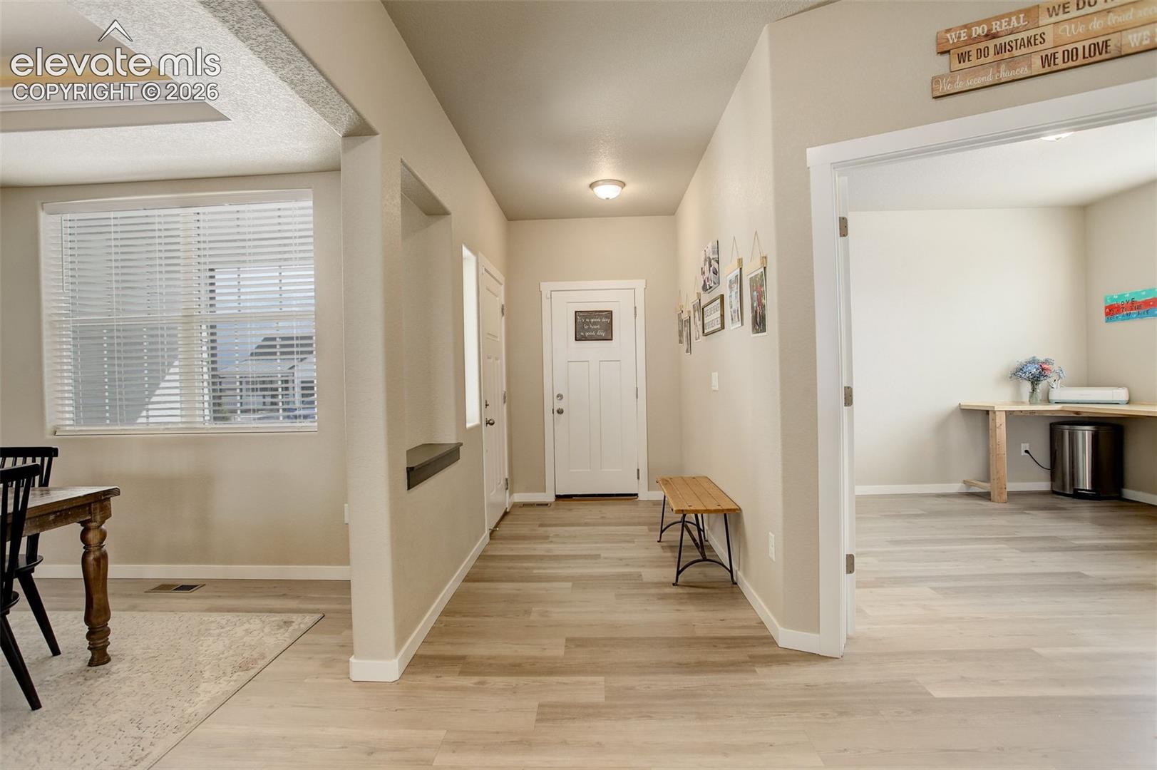 Foyer entrance featuring white oak LVP flooring.