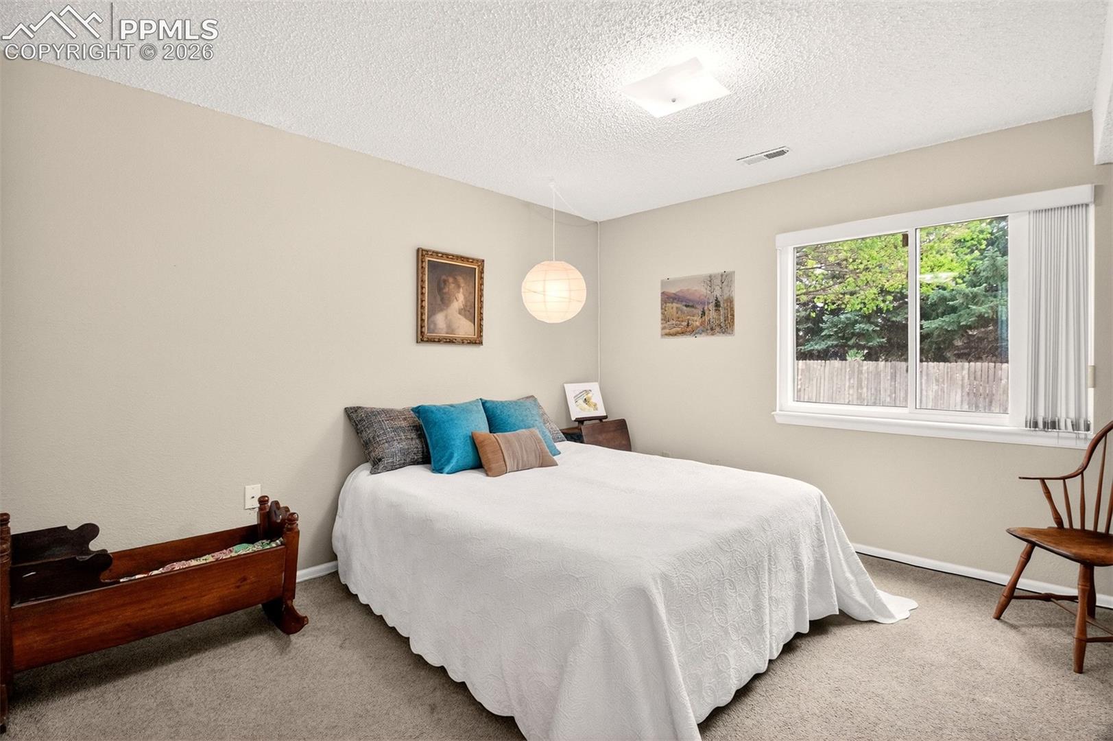 Oversized basement bedroom, ideal for guests or a home office.