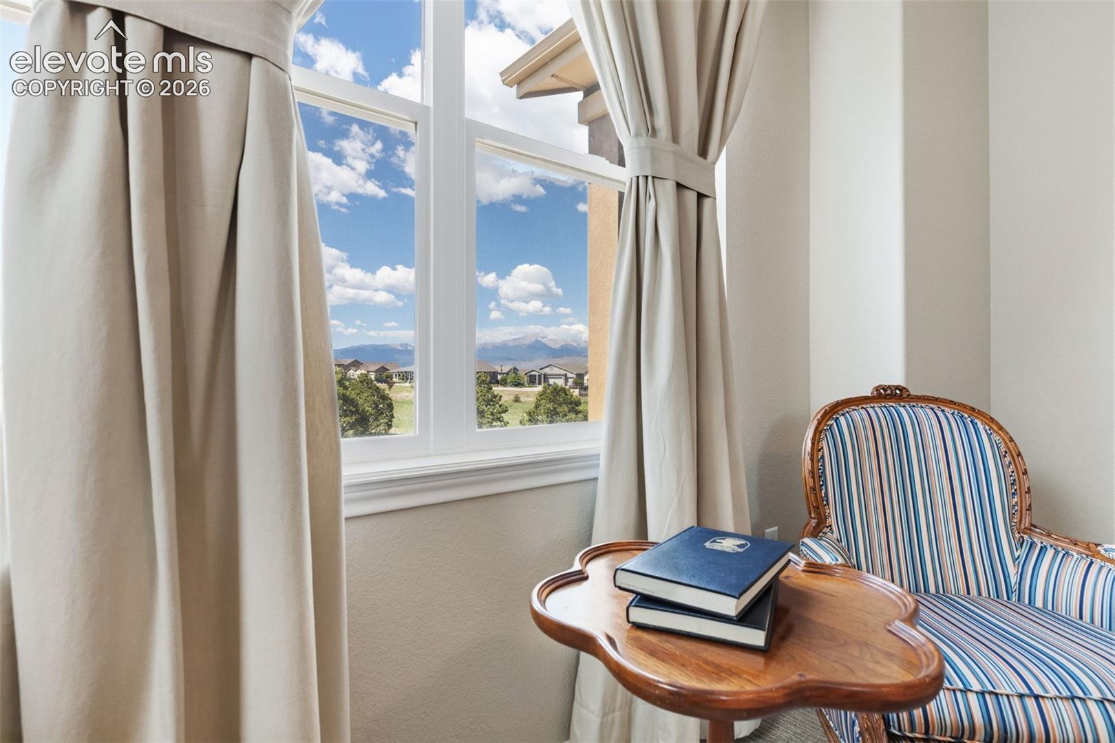 Sitting area with mountain views in primary bedroom