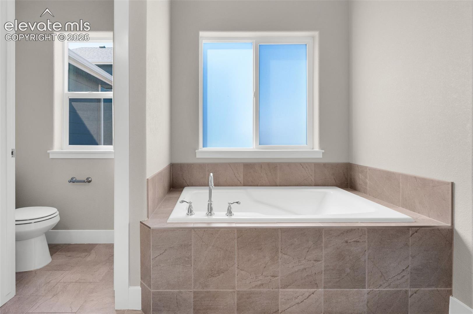 Even a soaking tub in primary bedroom