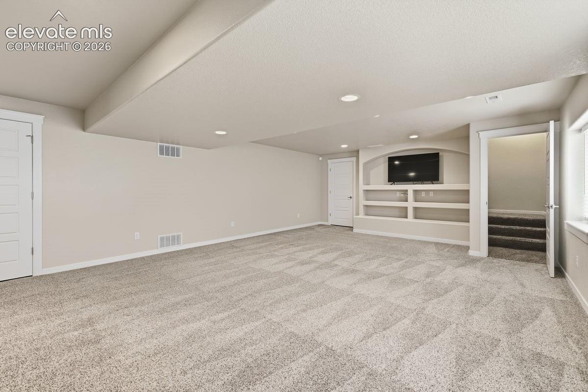 large family room area with custom built-in entertainment center