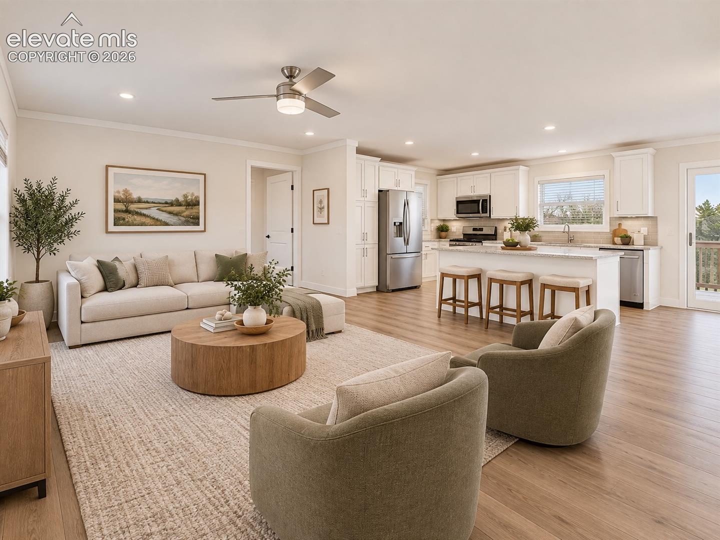 Open-Concept Living Area – Spacious main living area flows directly into the kitchen, with recessed lighting and coordinated flooring carrying throughout the open floor plan.