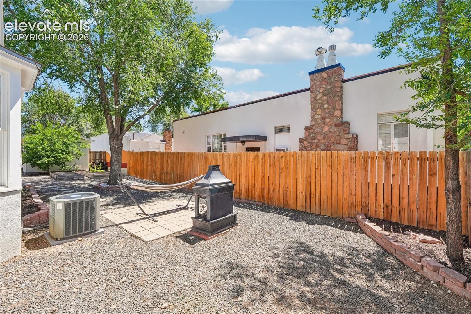 Backyard with wood burning fireplace