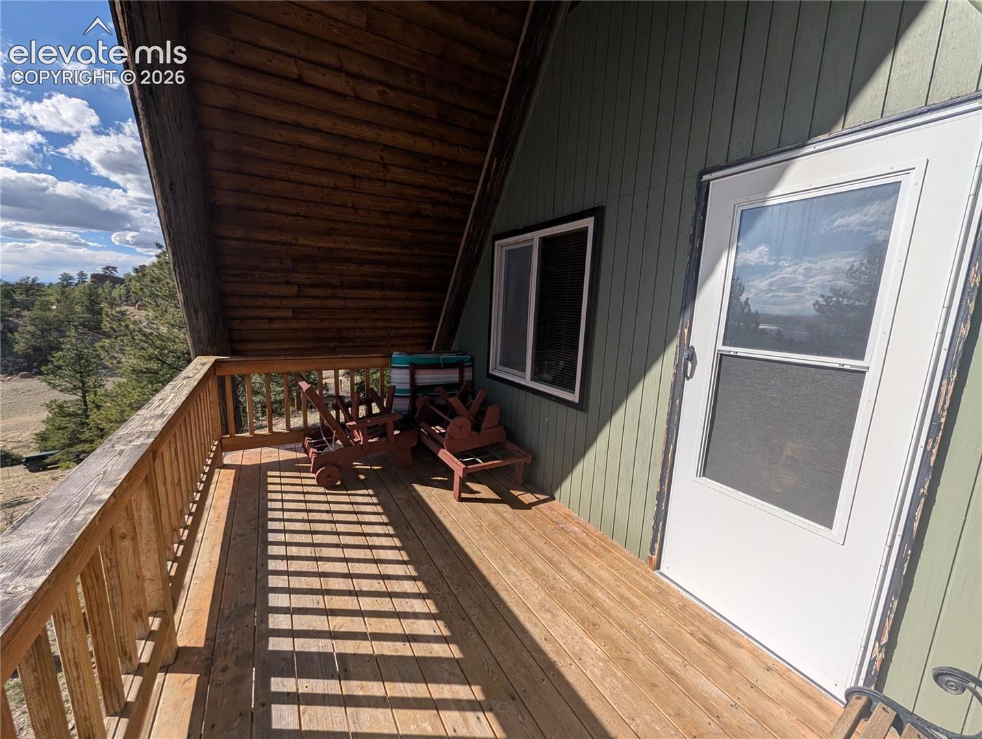 Wood-finish decking with a matching wood-finish railing