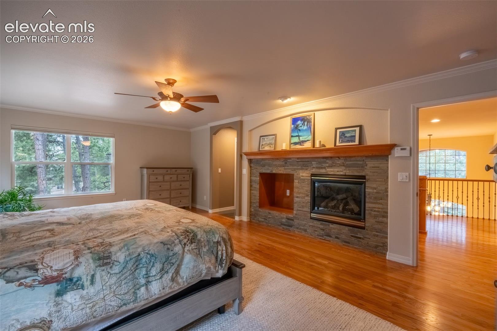 Primary bedroom (1) with fireplace, double walk in closet, and ensuite 5 piece bath - upper level