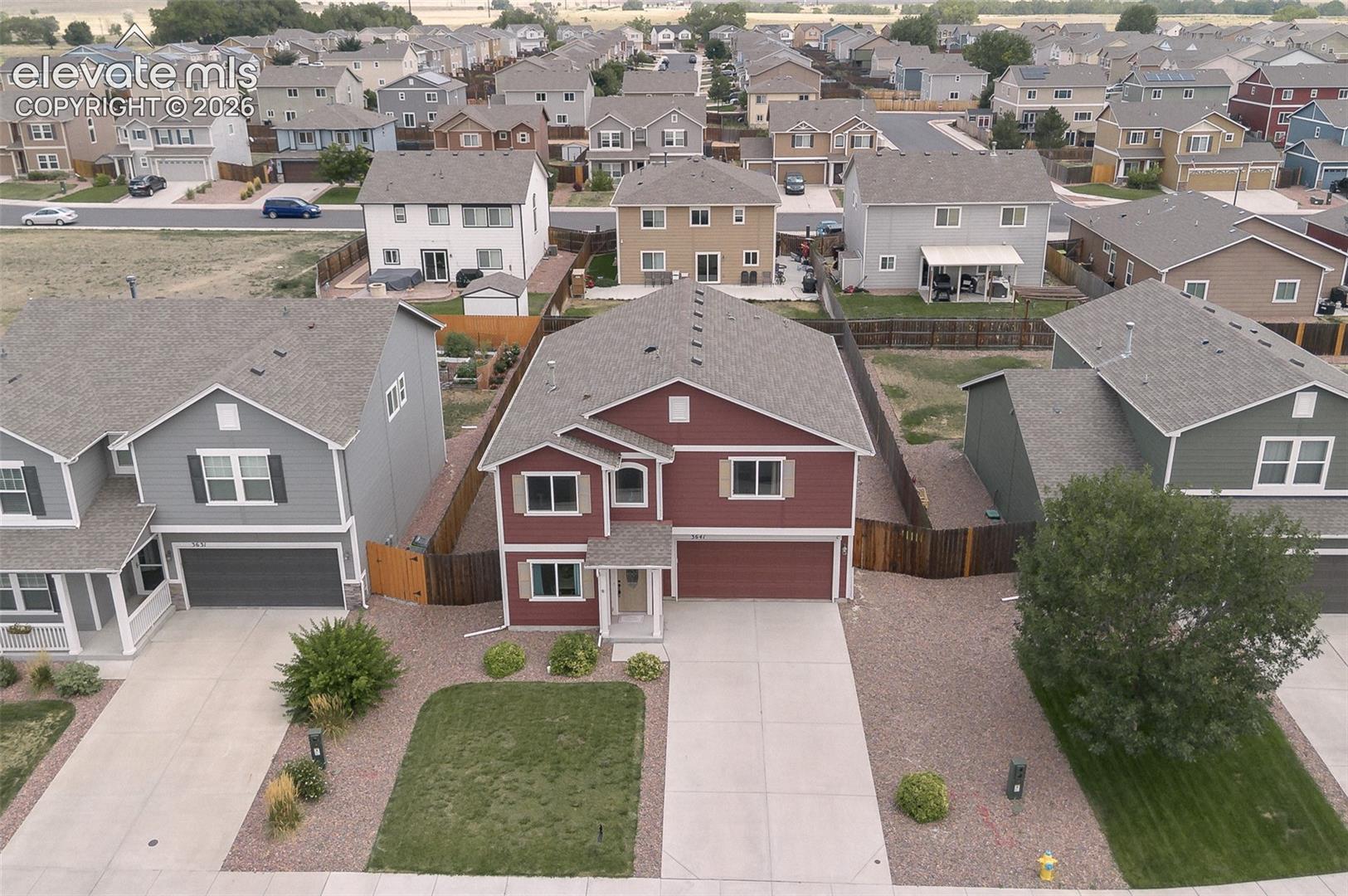 Aerial view of home and front yard.
