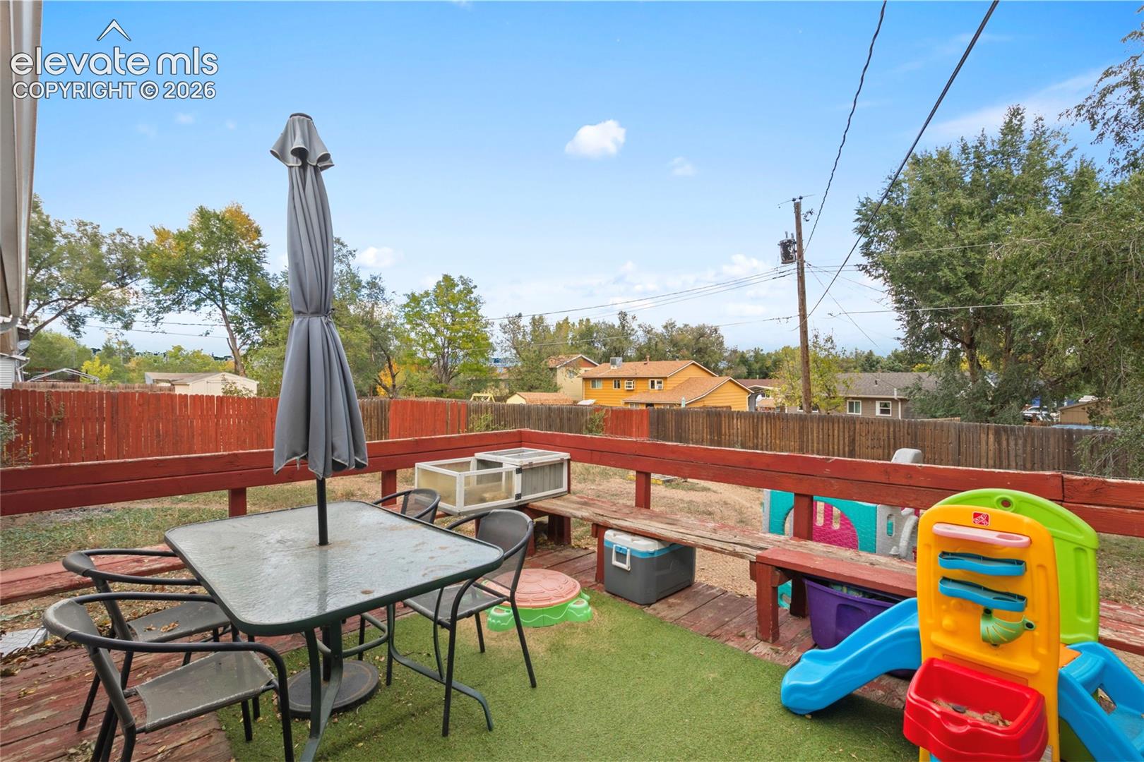 Deck with view of backyard