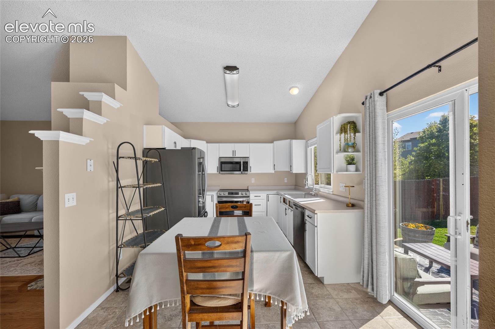 Refreshed kitchen with stainless appliances (2022) and updated cabinet fronts and hardware