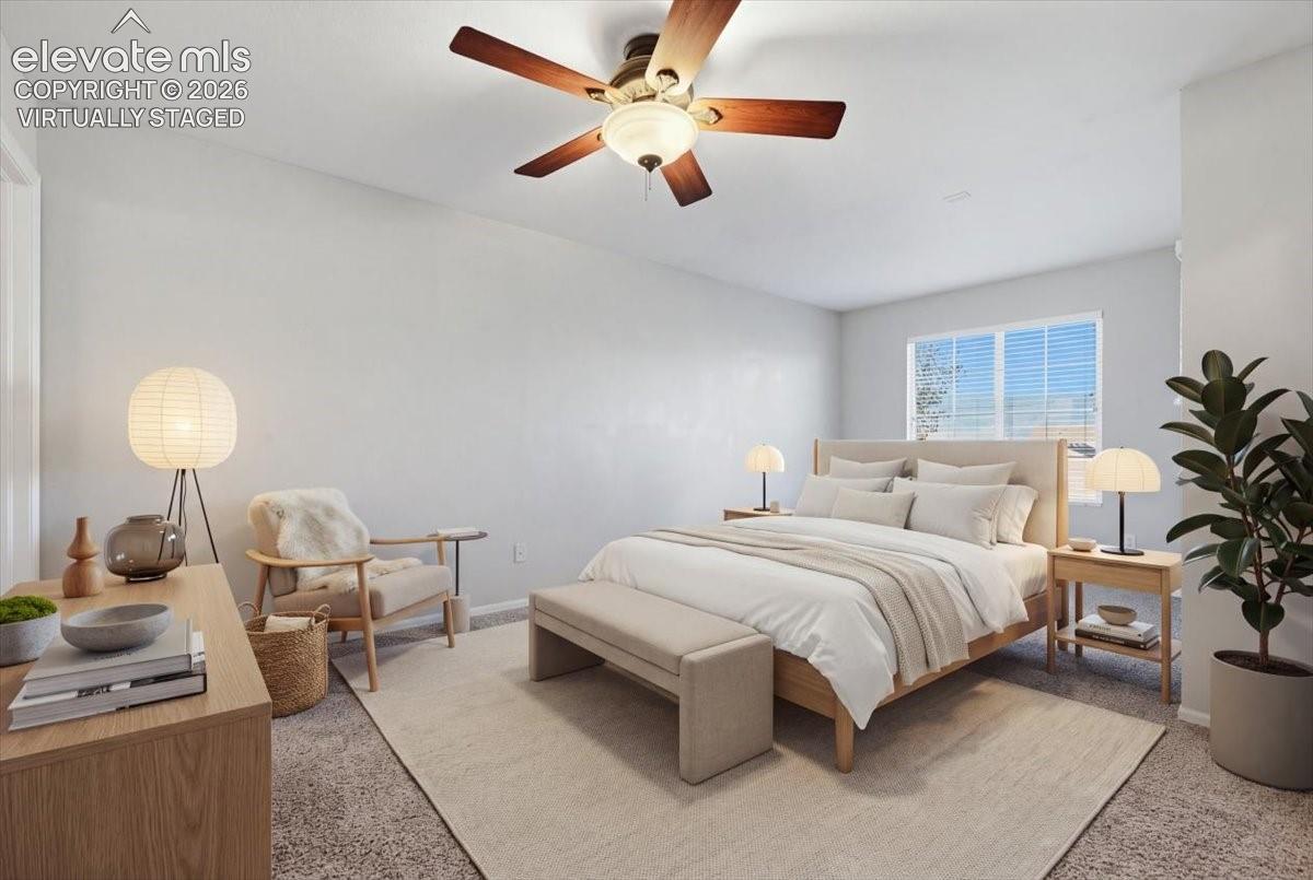 primary bedroom with private balcony. Virtually staged