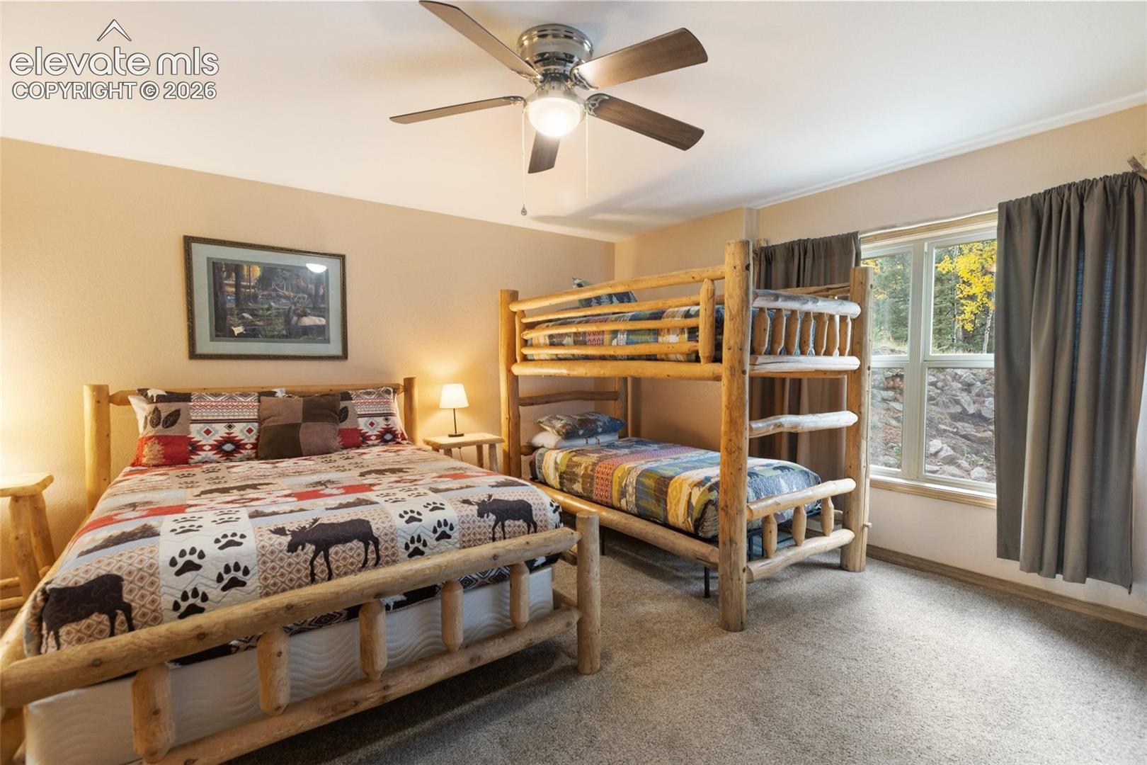 Recessed window with trim, light-colored walls, and a ceiling fan with integrated lighting