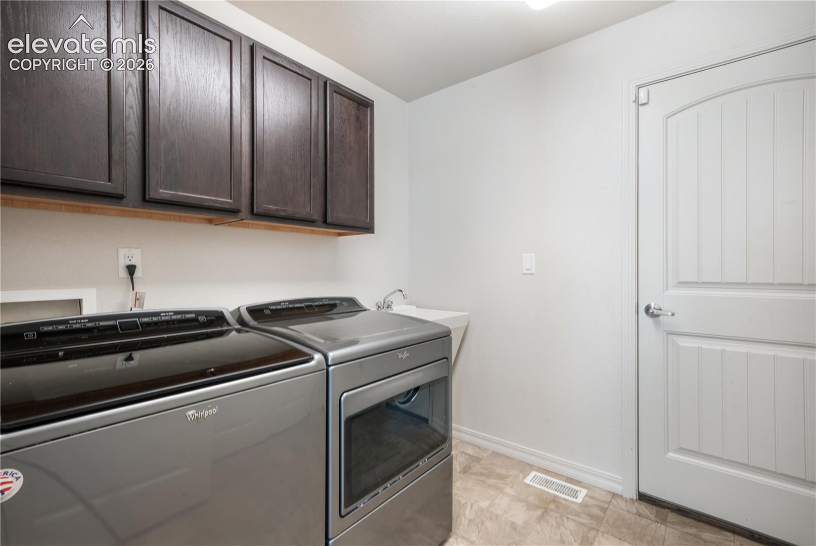 Main floor laundry room, access to the garage