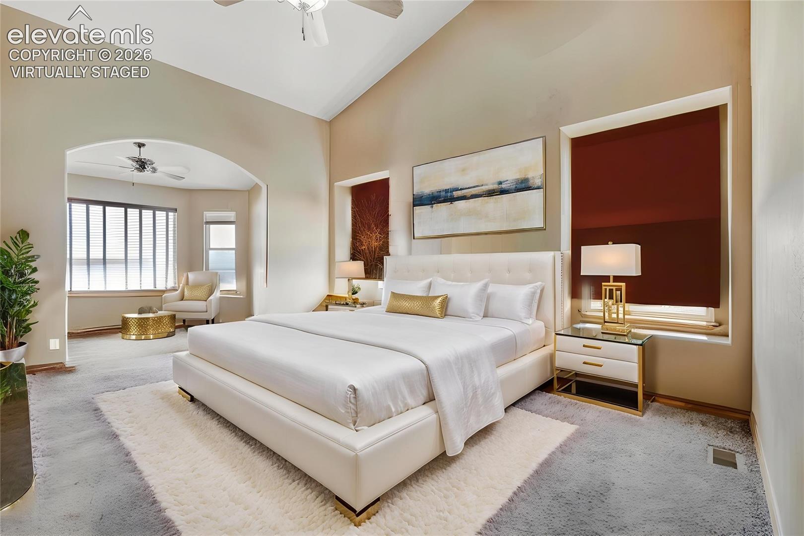 Virtually Staged - Vaulted ceilings and an arched entryway enhance this spacious room