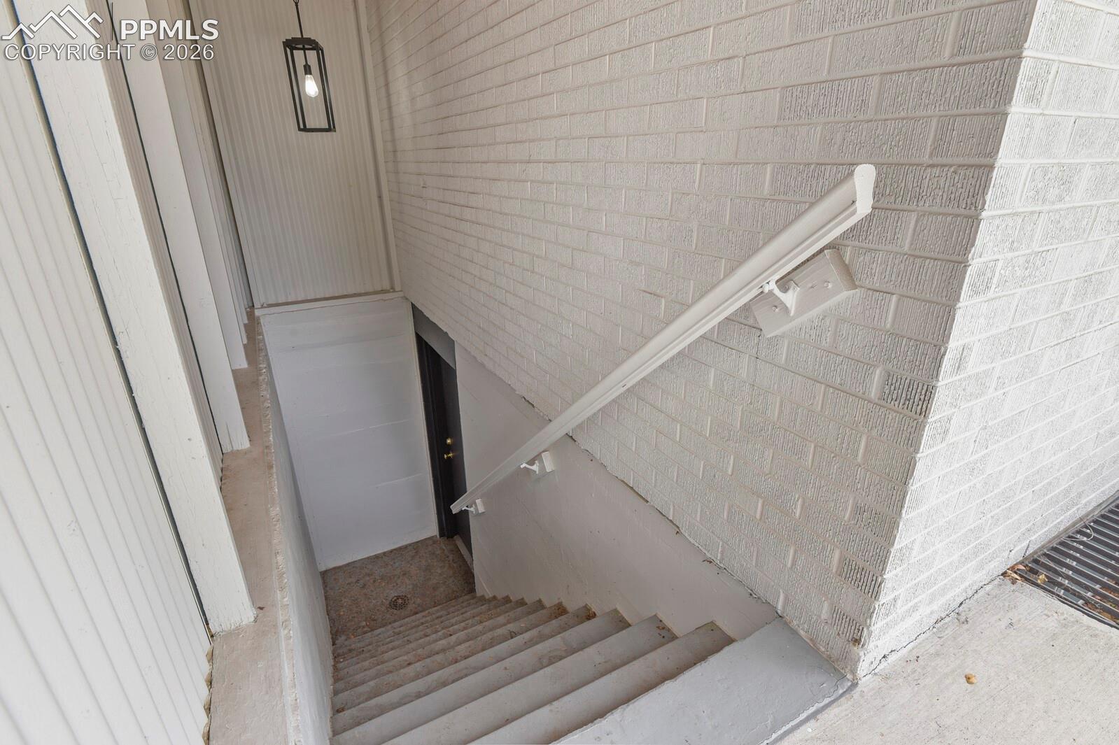 Stairs in backyard leading to basement private entrance