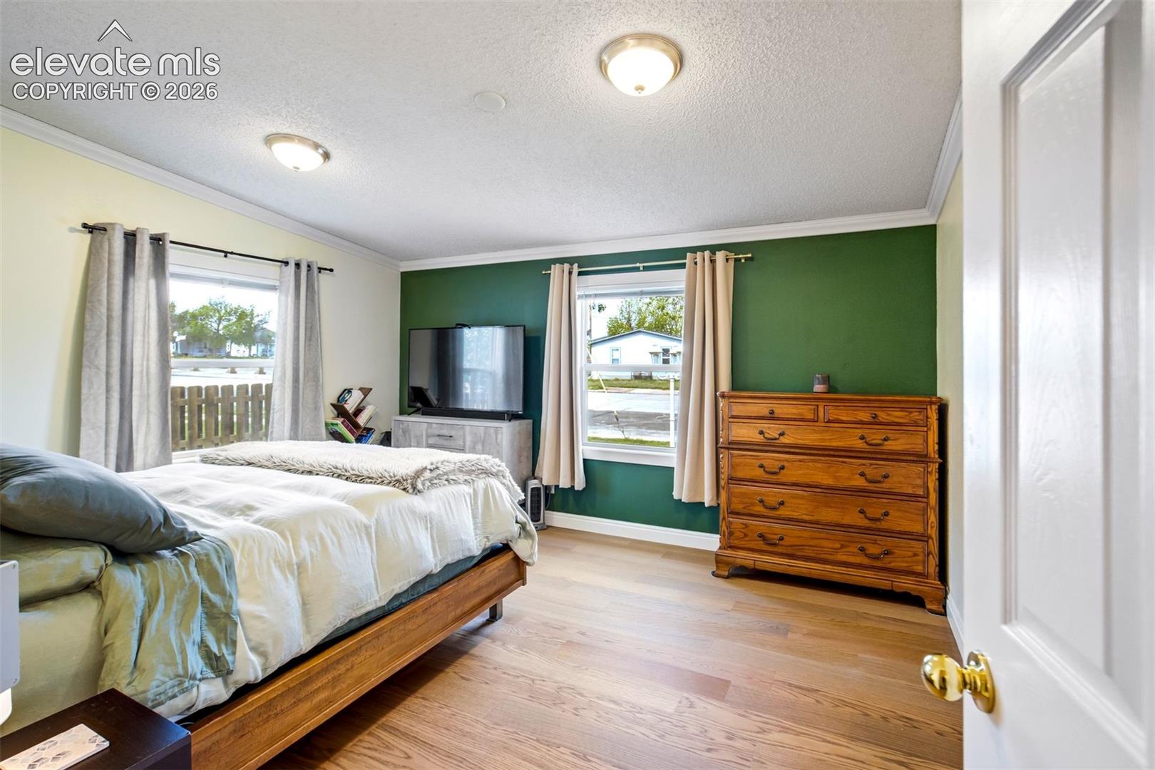 Updated flooring continues into the bedroom spaces.