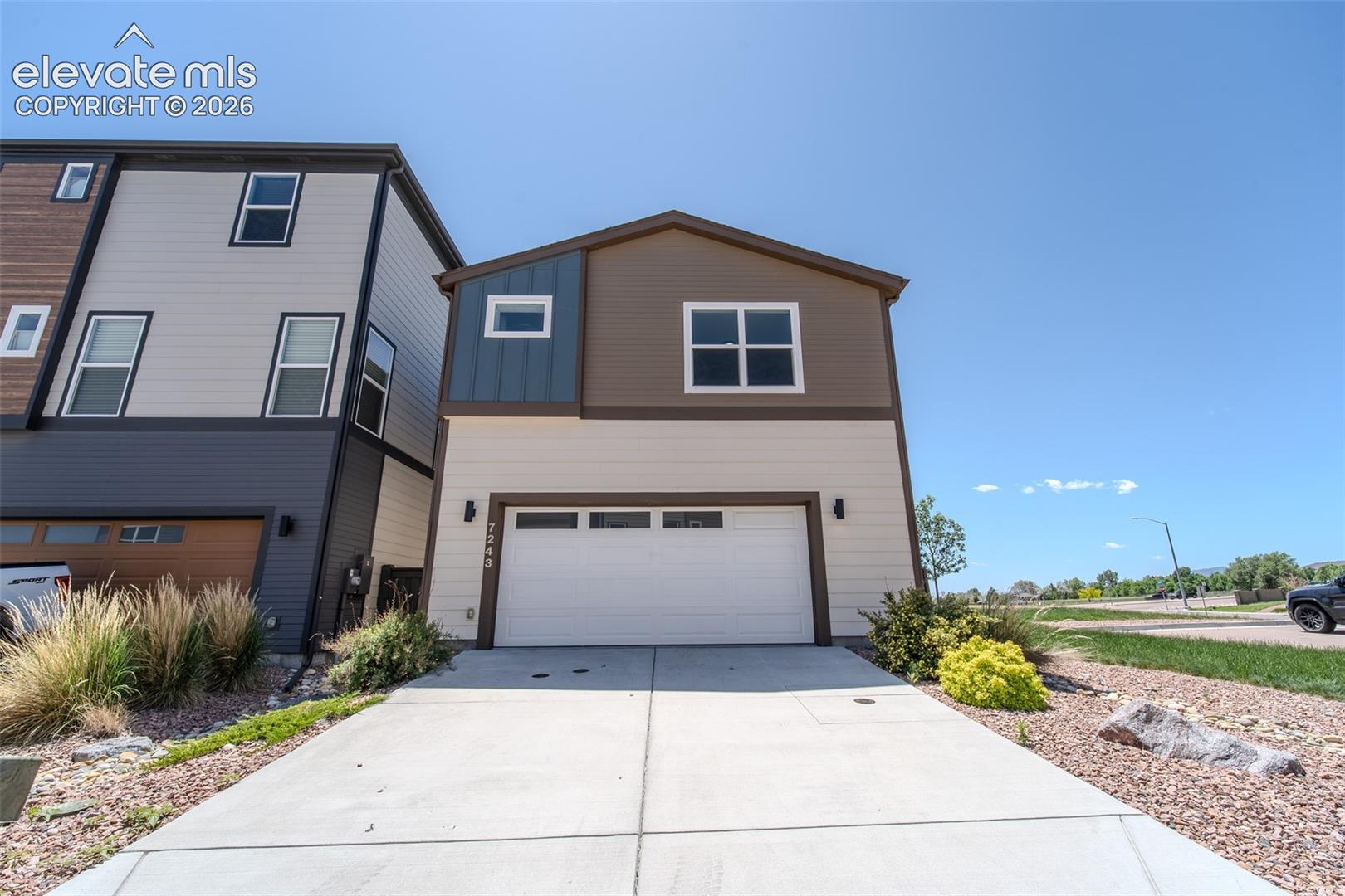 Rear of home and view of corner lot.