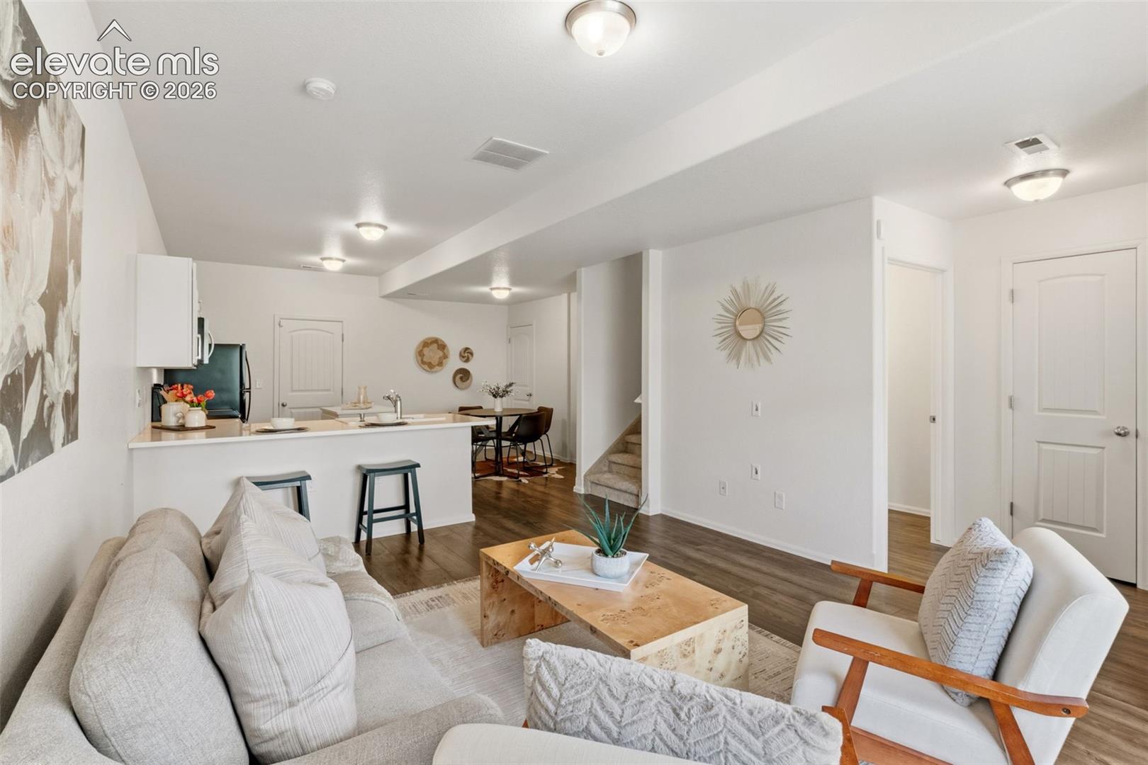 The seamless flow between the living room and kitchen makes entertaining family and friends an absolute breeze
