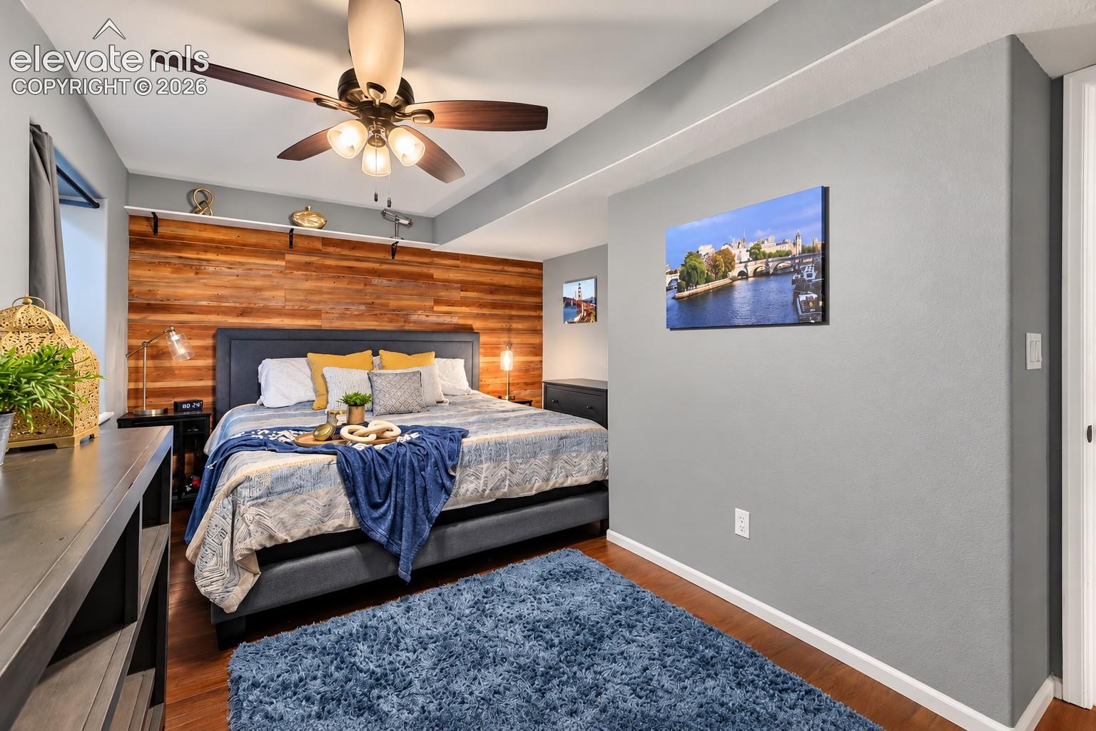 A bright secondary bedroom offers comfortable space for family, guests or a home office.