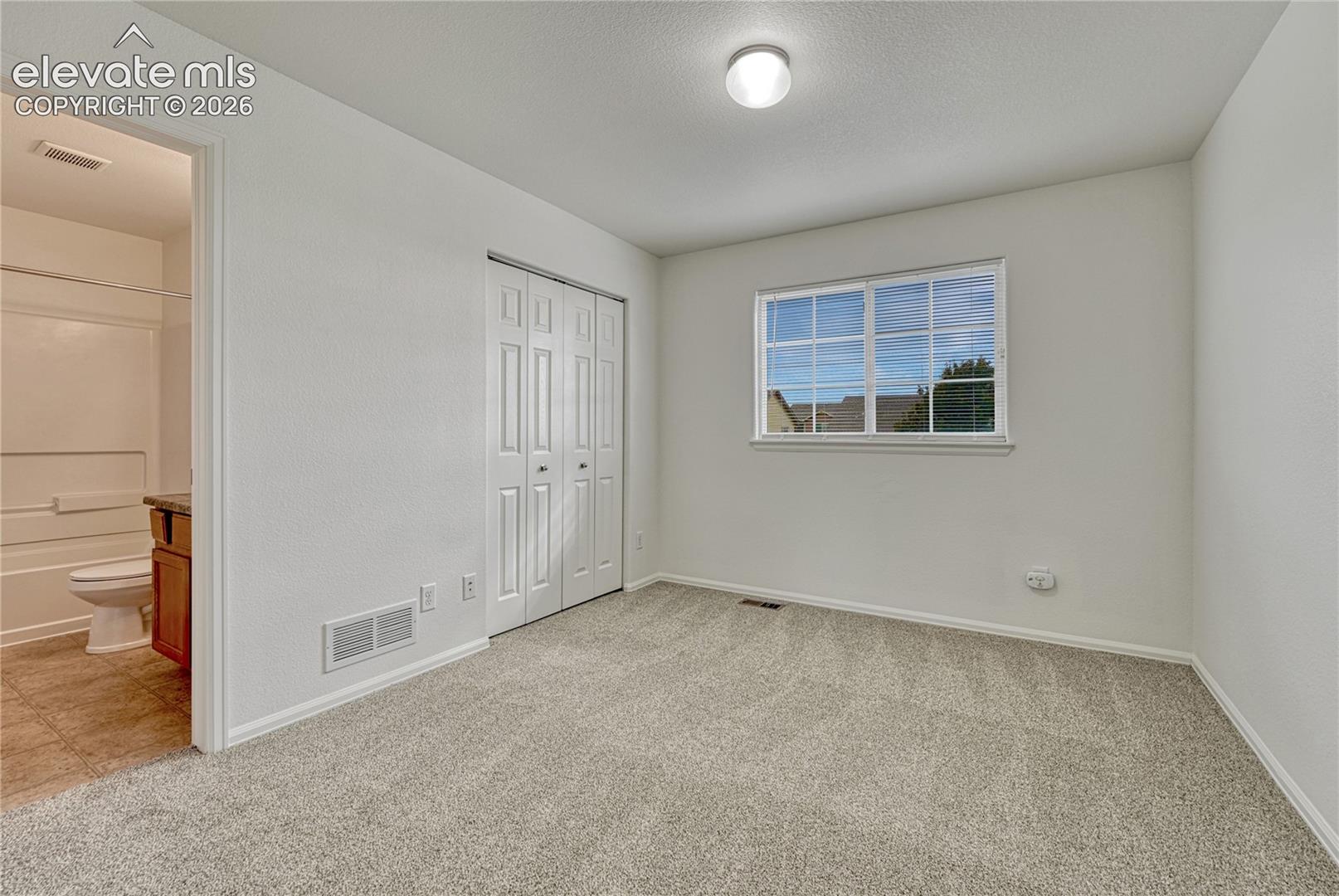 First of two additional bedrooms...