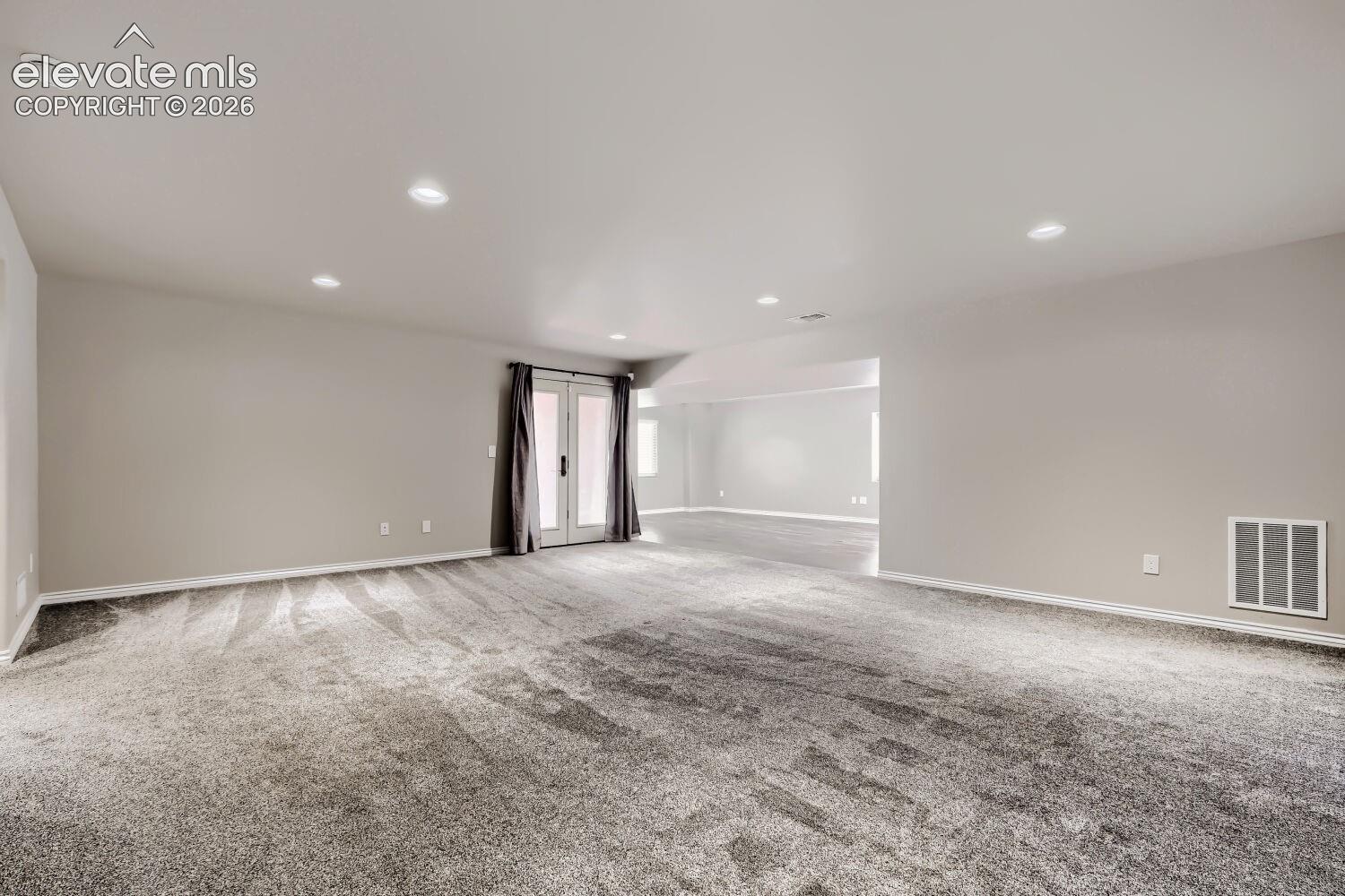 Basement family room with walkout, large rec room that can be game area, hobby area, playroom, or exercise room.