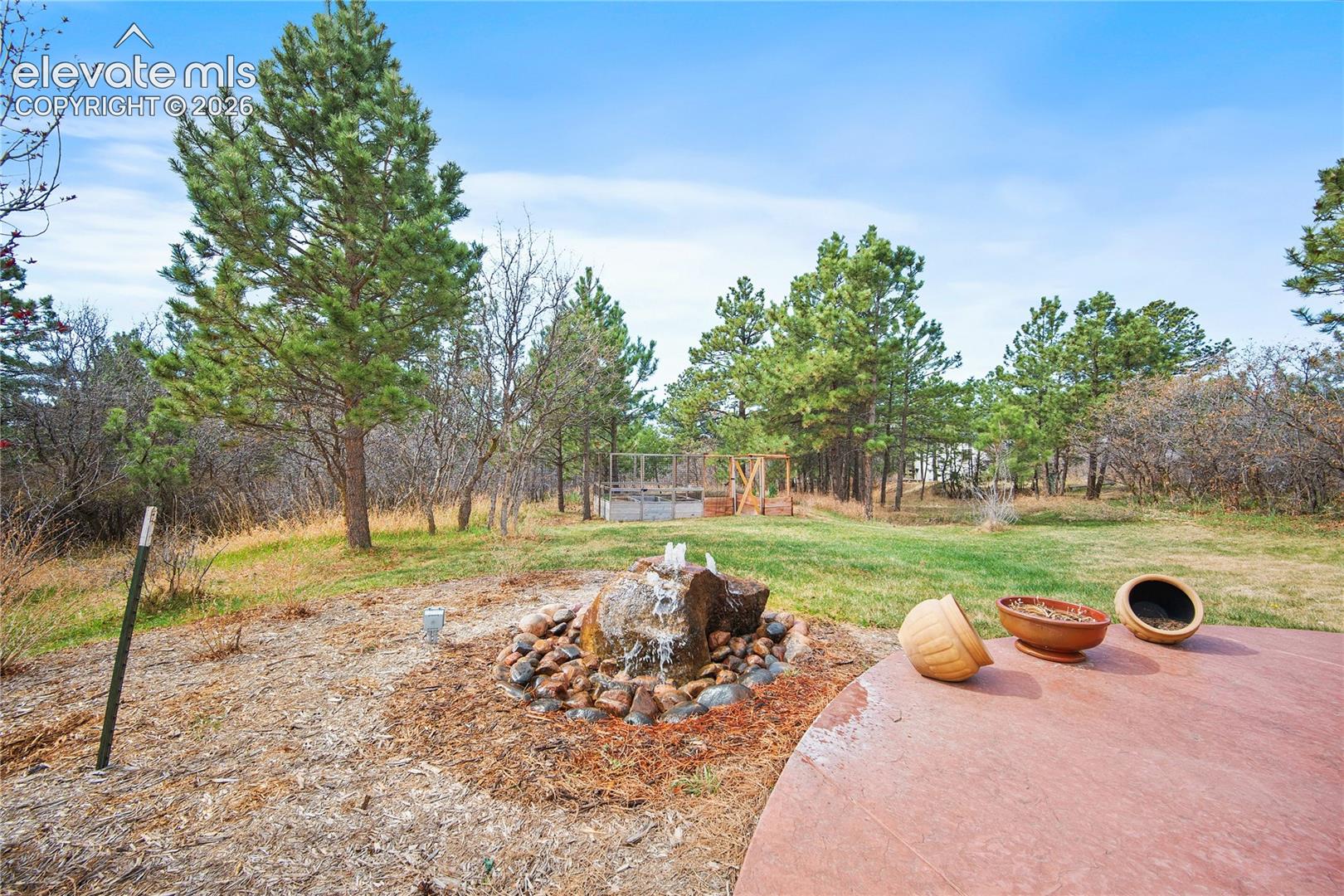 Water feature and large patio area. 
