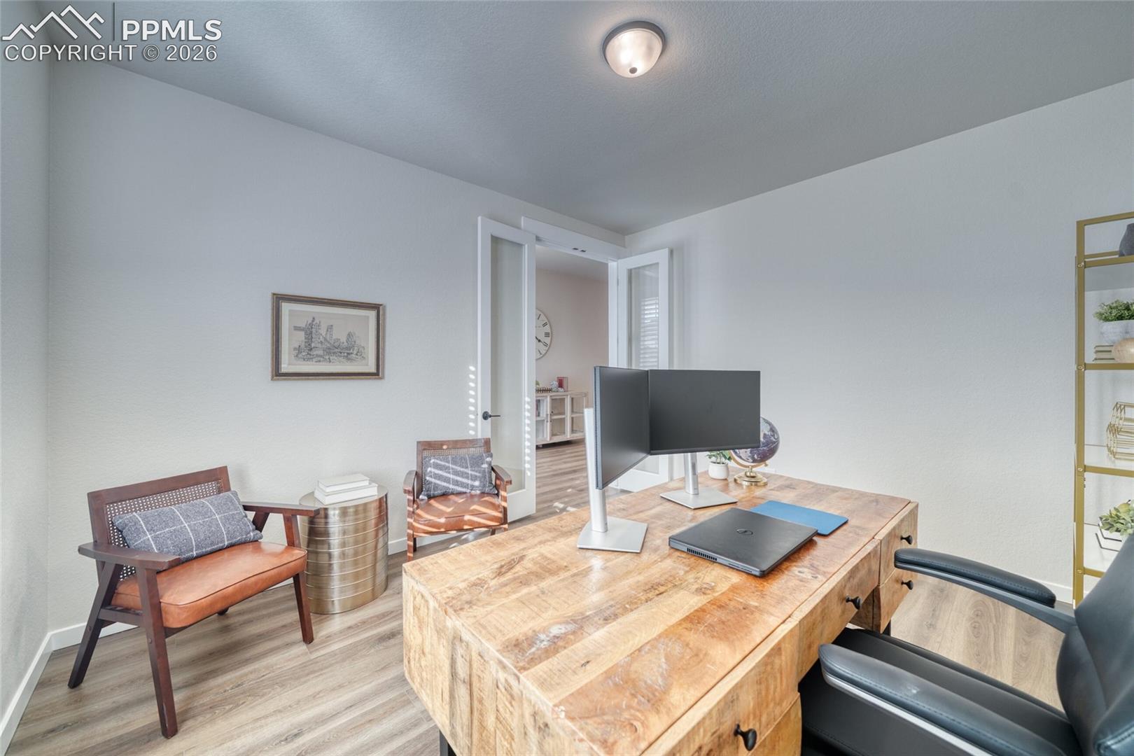 Office featuring light wood-style floors