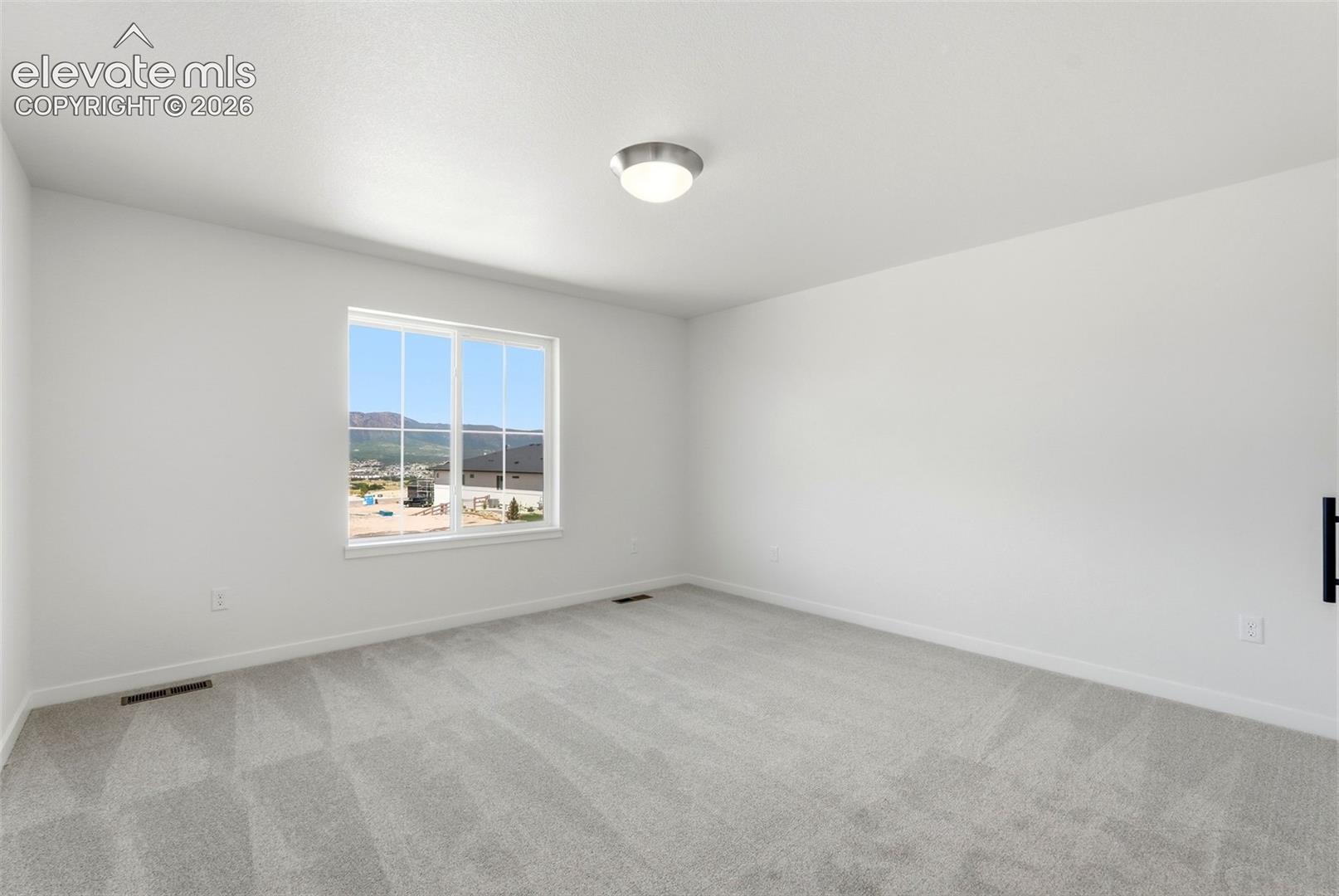 The Primary Bedroom walks out to the Covered Balcony