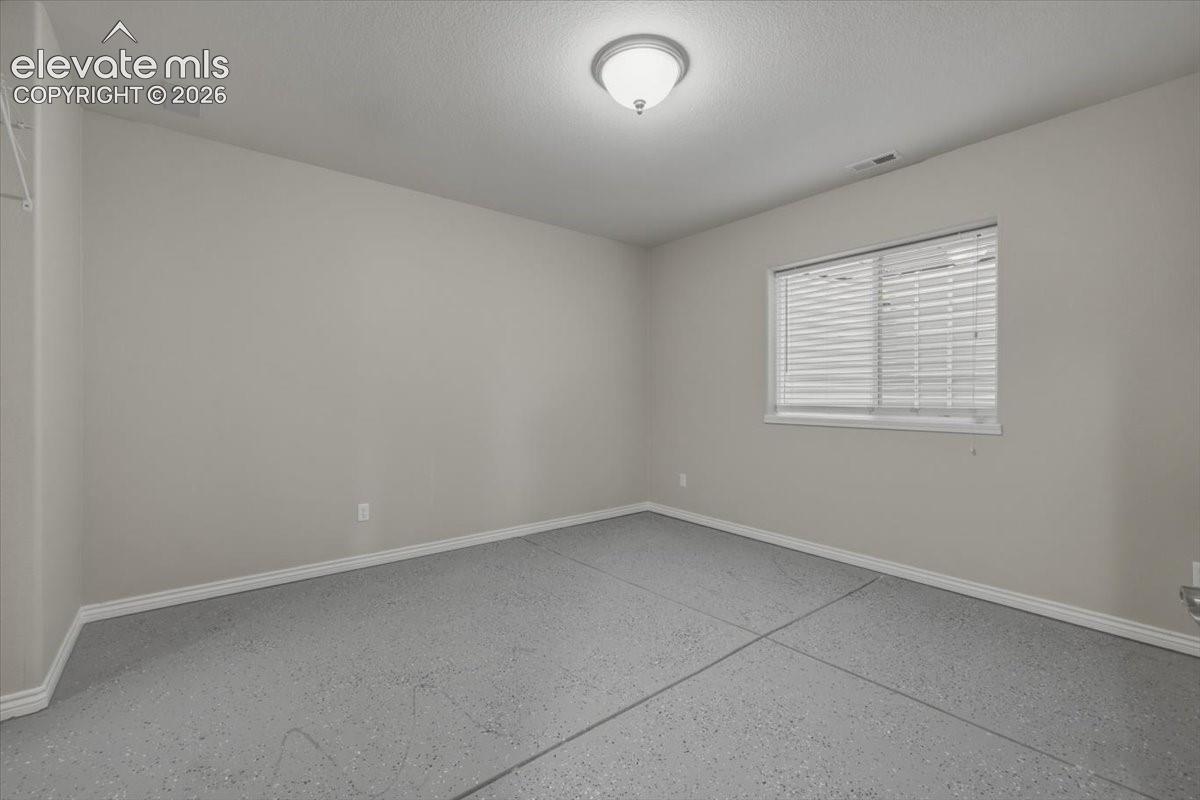 bedroom, gym and/or strorage area, walk in closet 